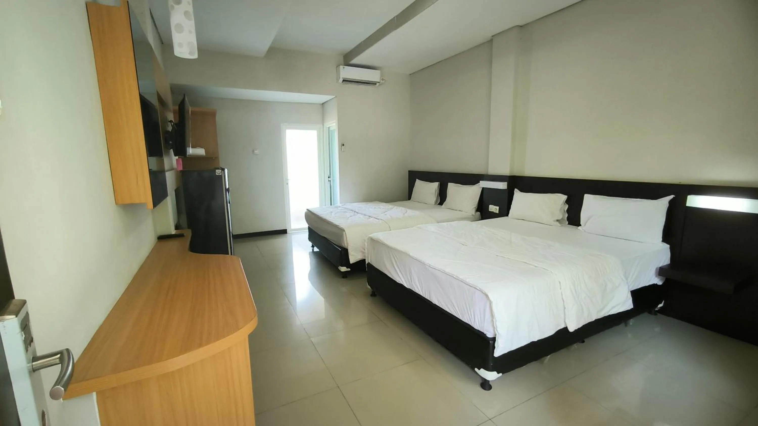 Bed in New Bandengan Beach Hotel