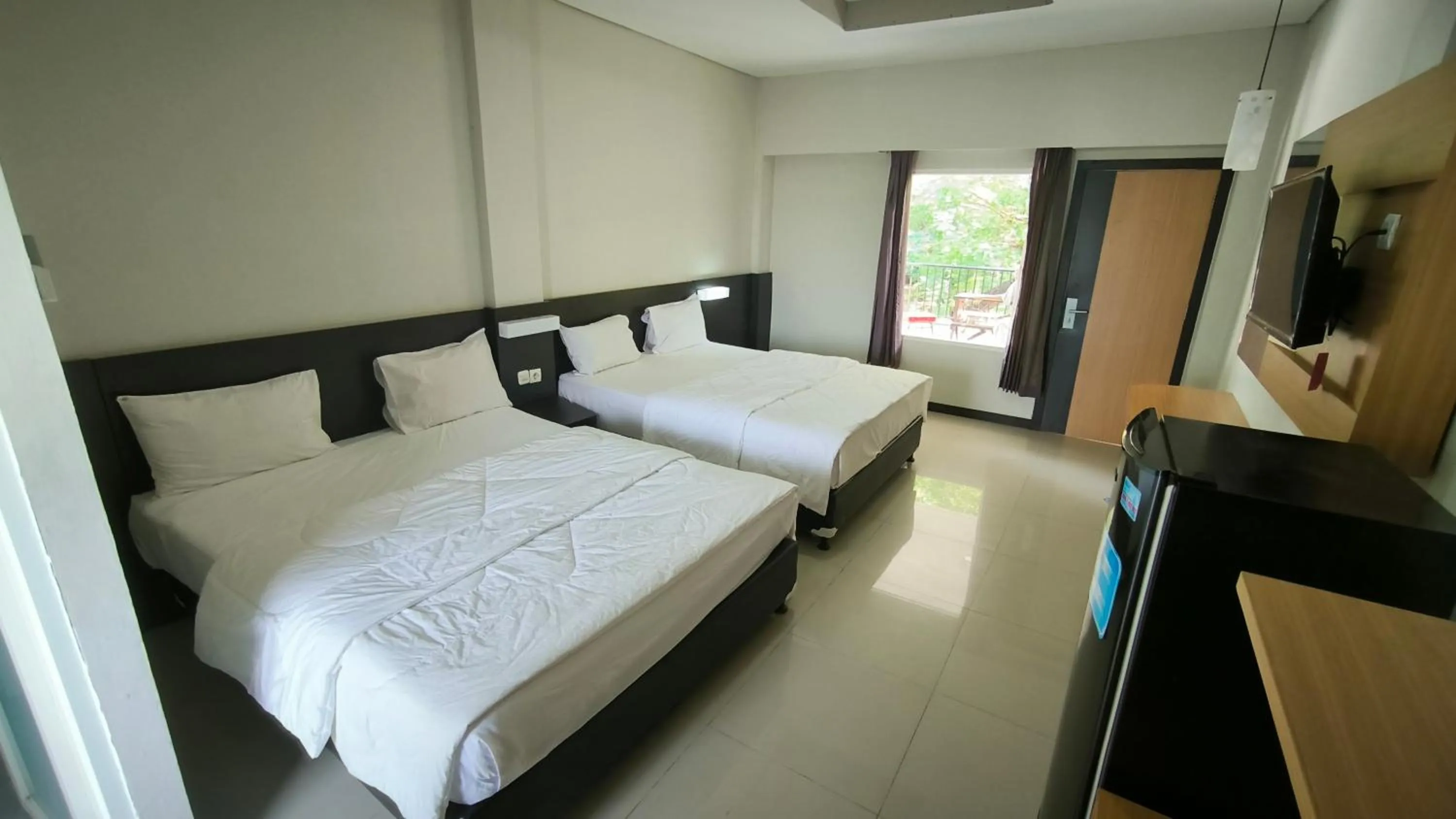 Bed in New Bandengan Beach Hotel