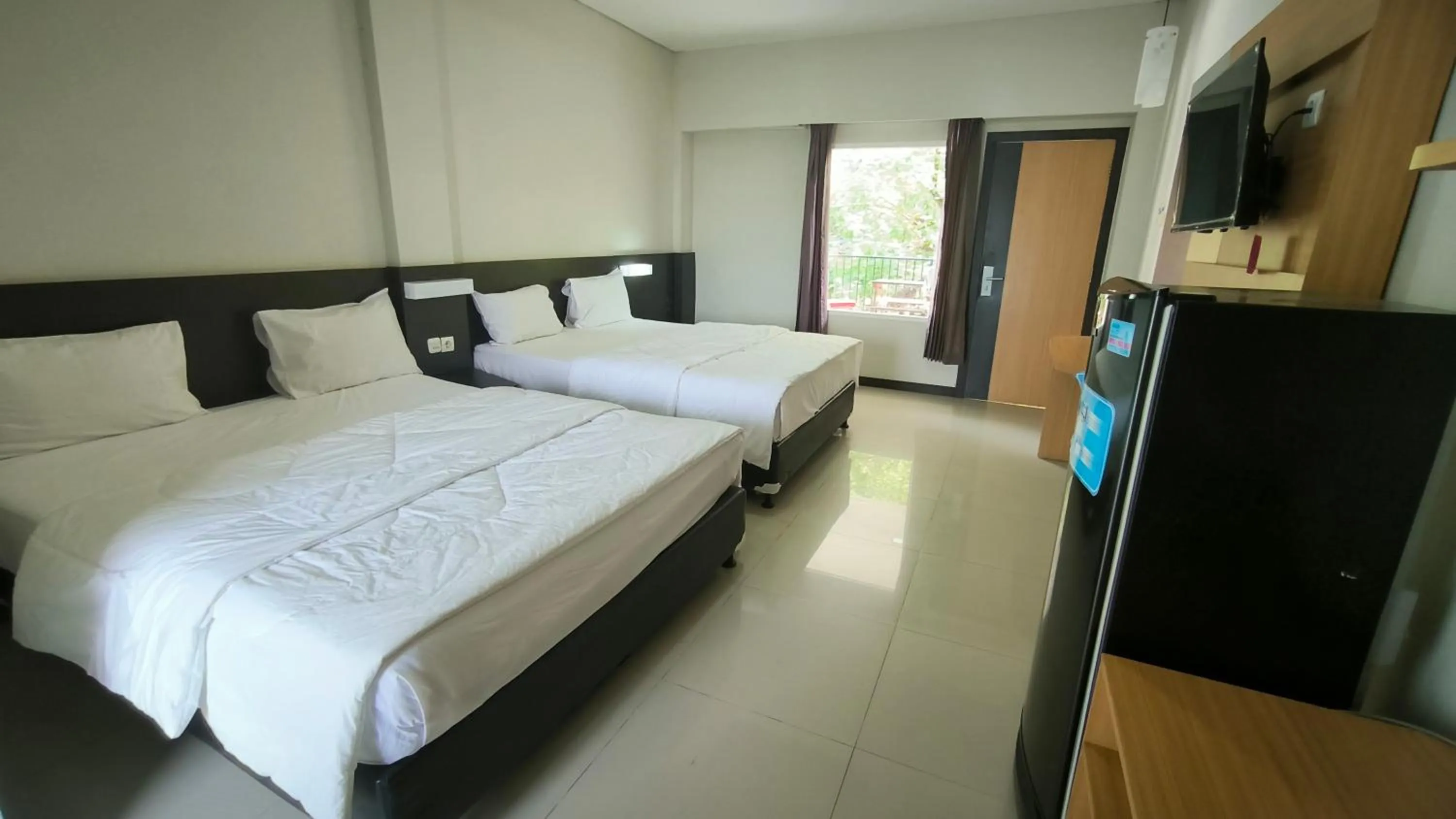 Bed in New Bandengan Beach Hotel