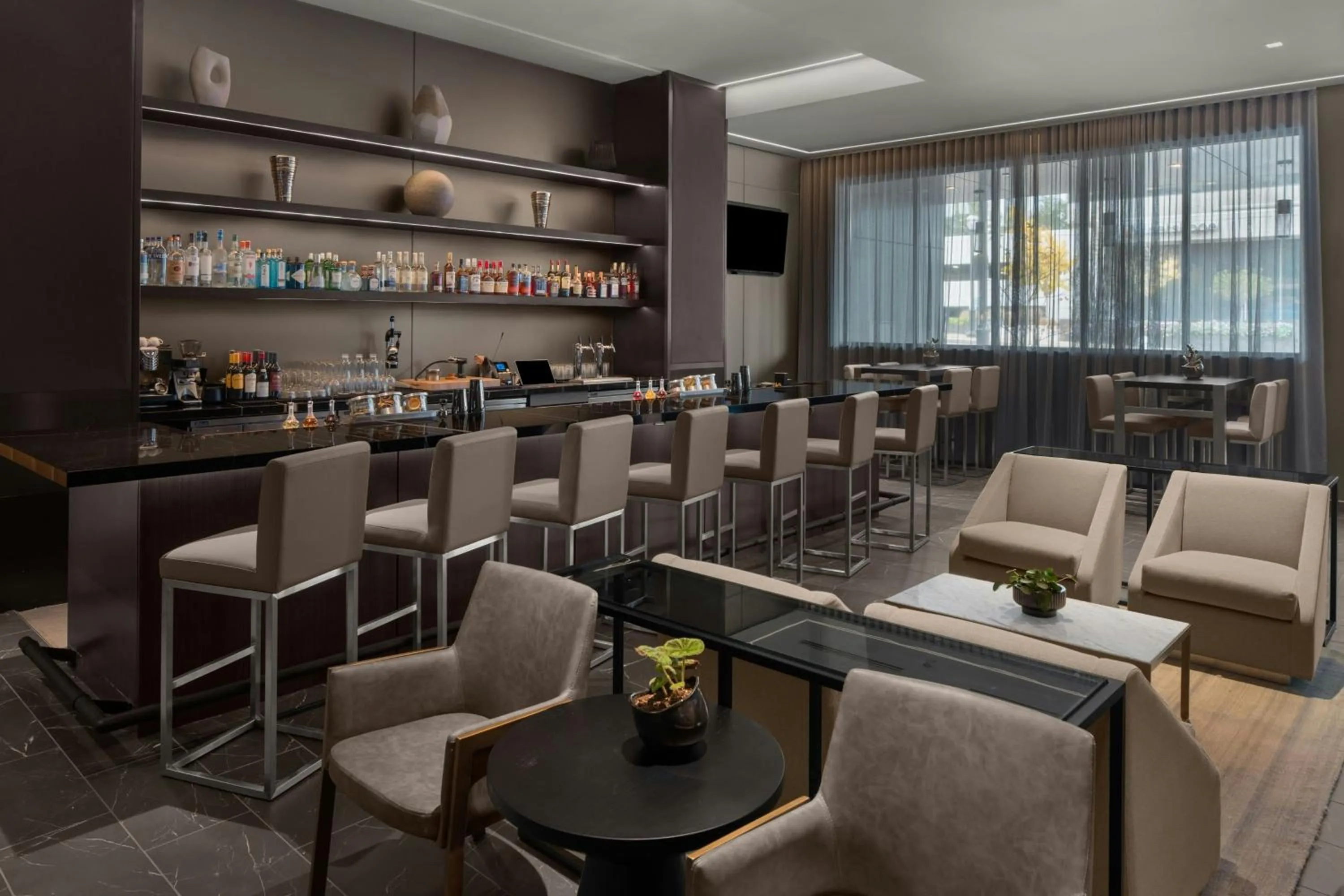 Lounge or bar in AC Hotel by Marriott St. Louis Clayton