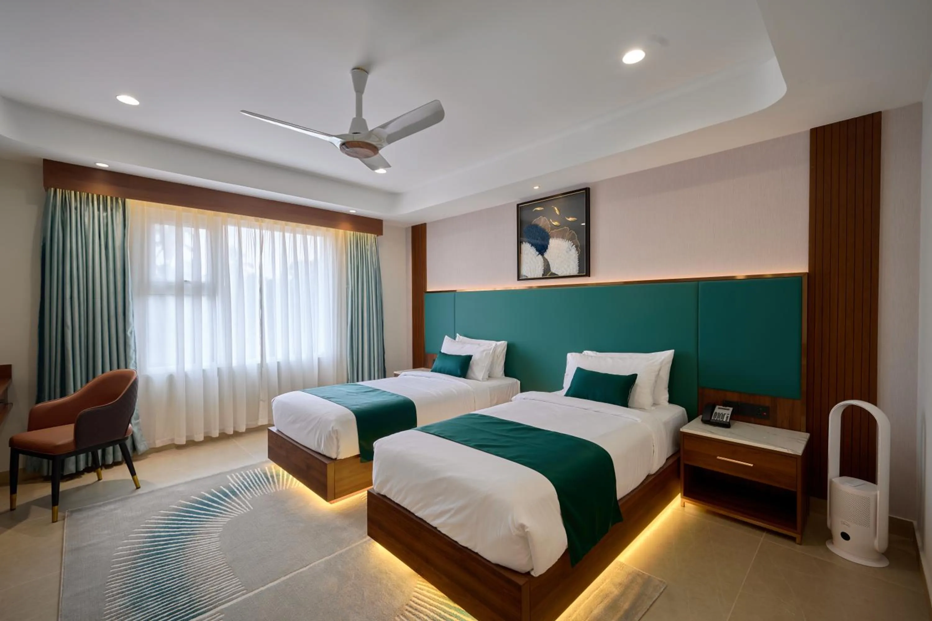 Photo of the whole room, Bed in Kowju Airport Hotel Calicut
