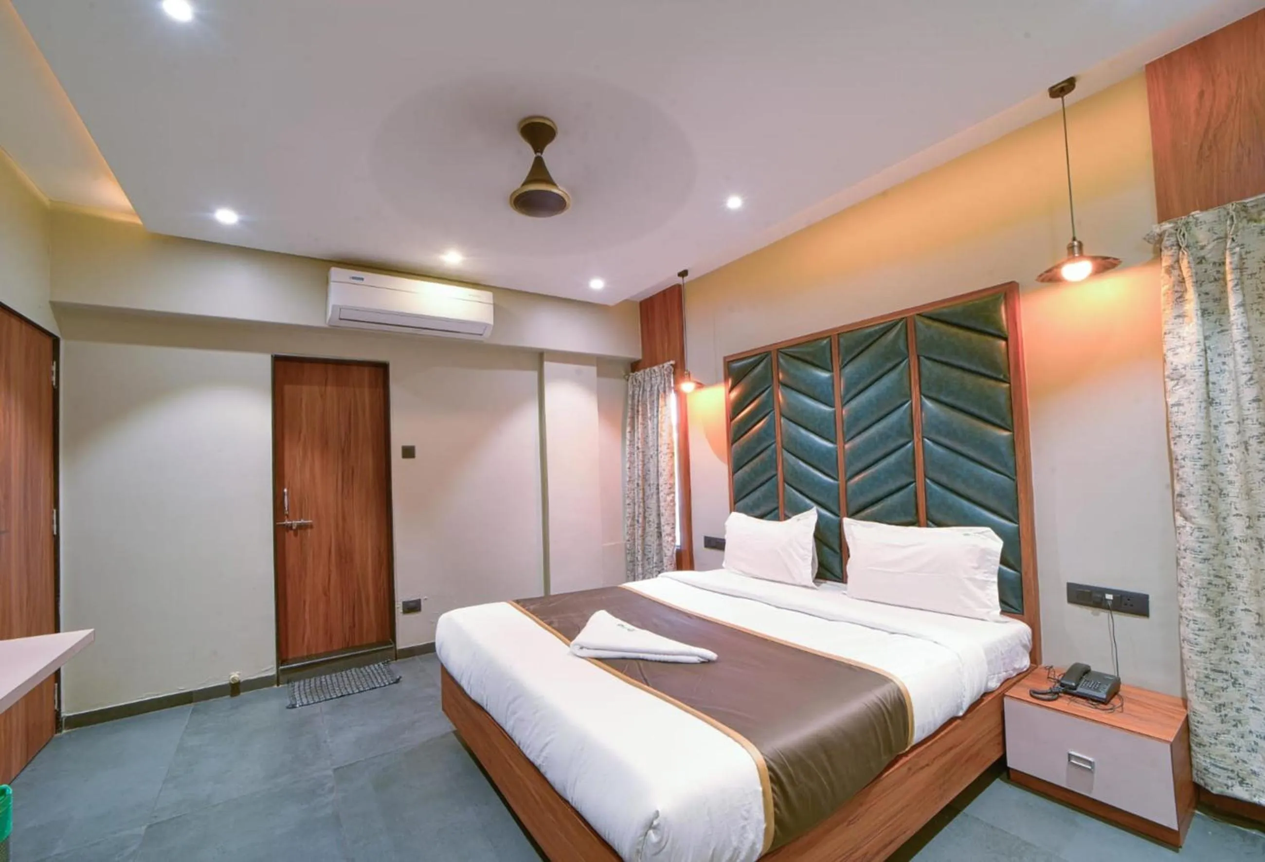 Bedroom in Hotel Vrindavan Deluxe Kolhapur NEAR CENTRAL BUS STAND