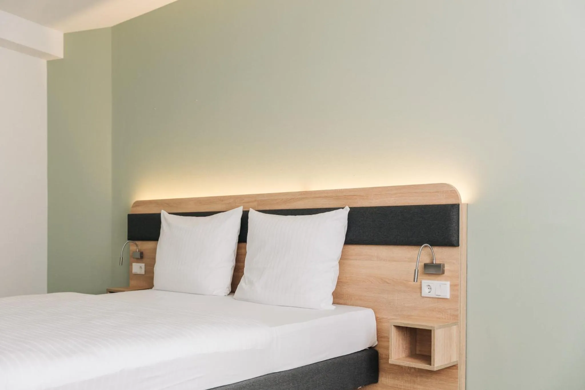 Bed in Homaris Corner Hotel