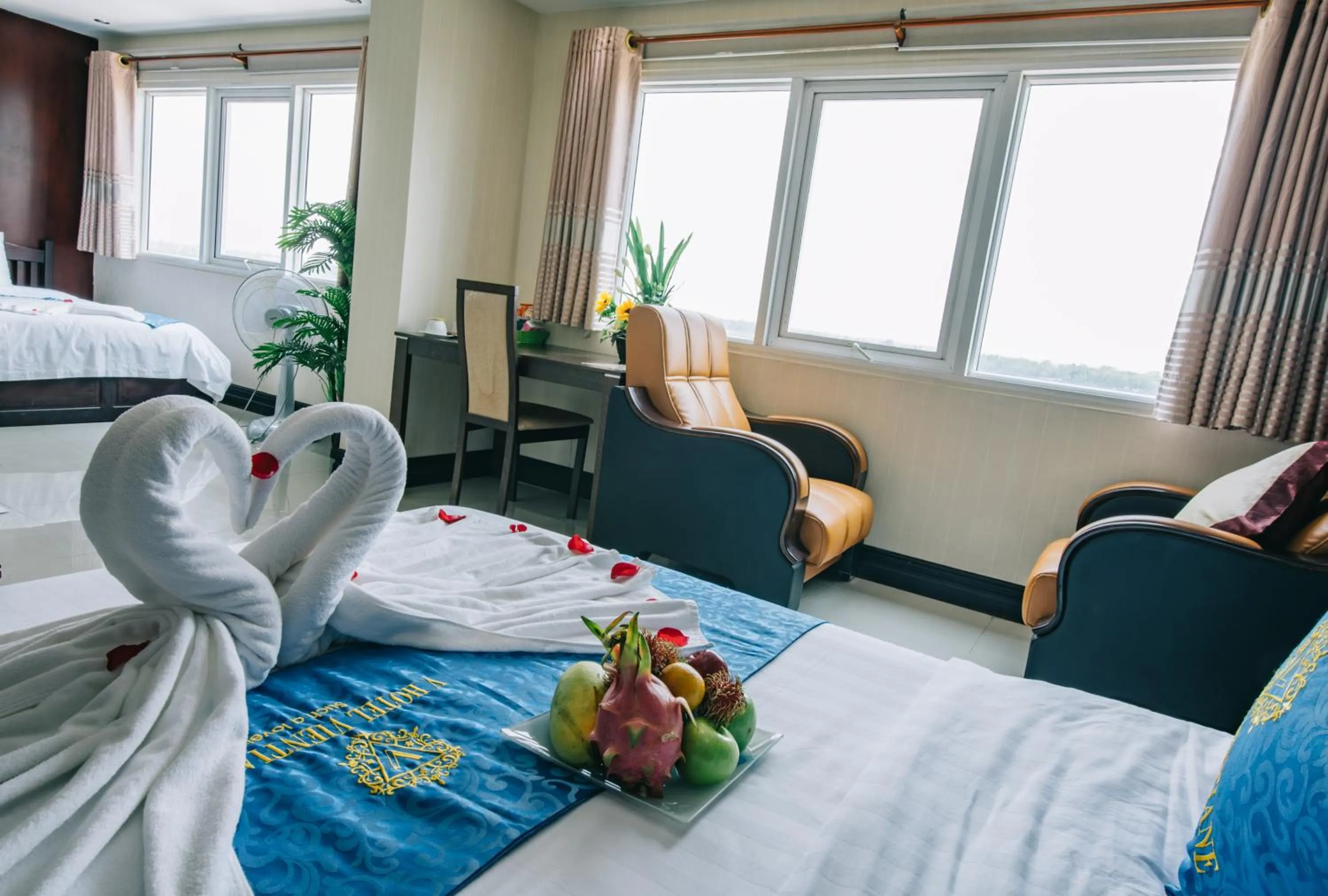 Seating area, Bed in V Hotel Vientiane