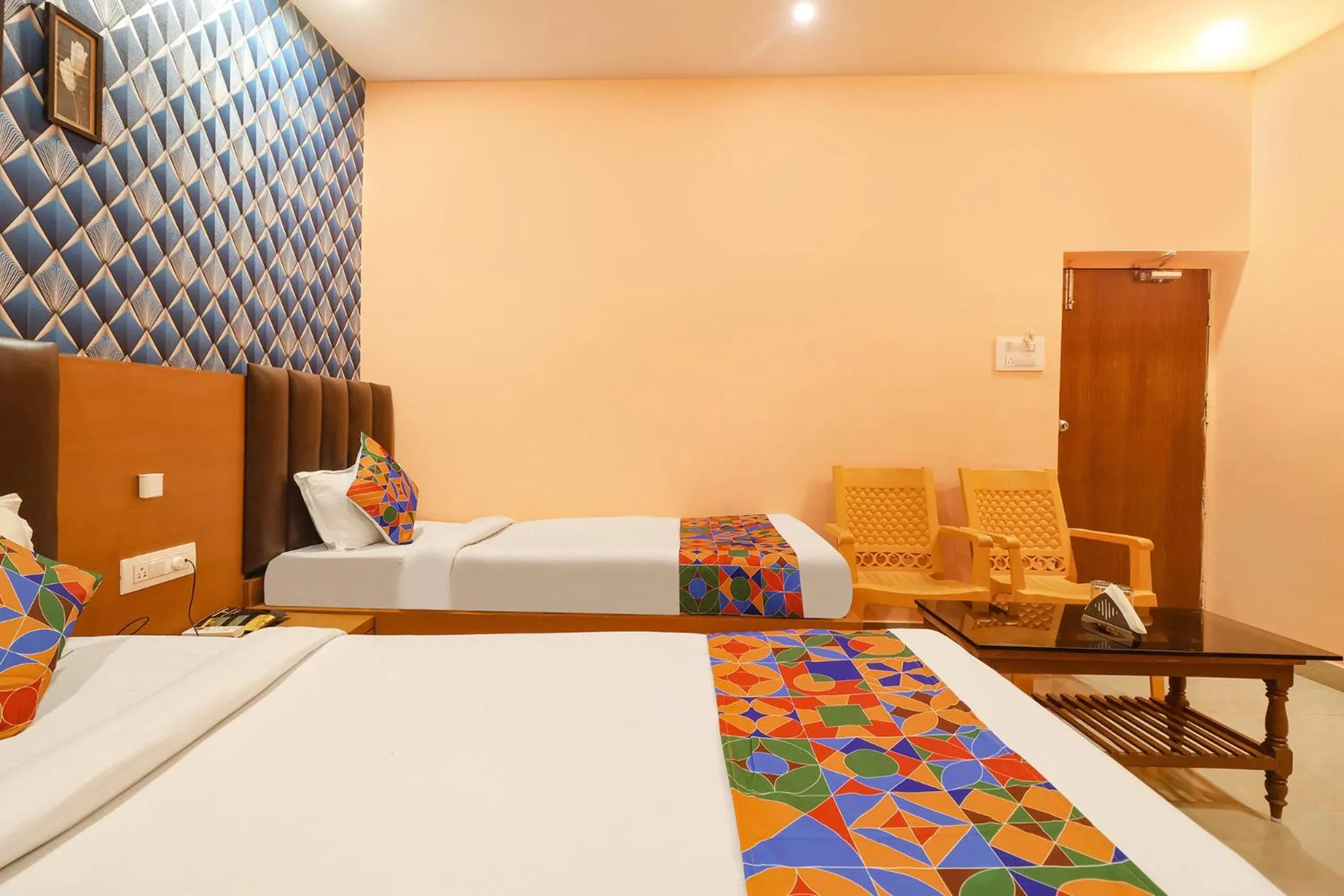 Bed in FabHotel Shanti International