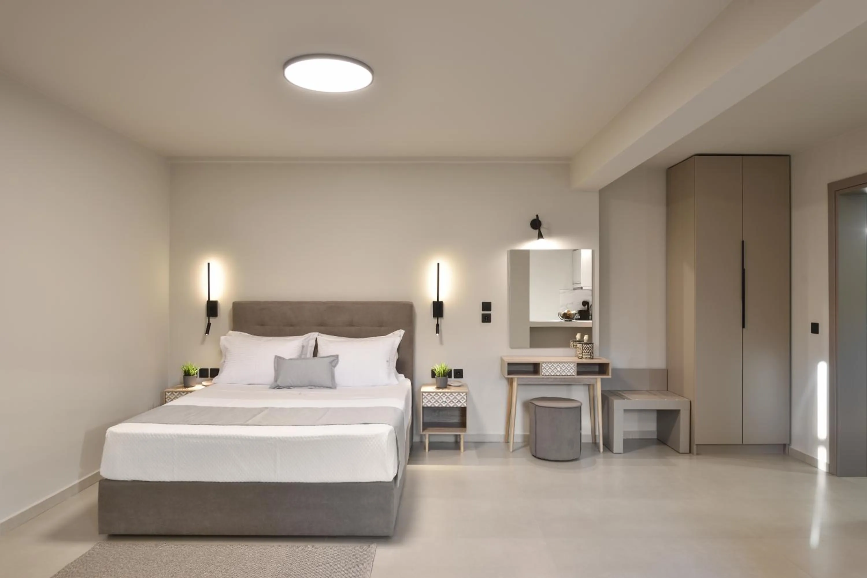 Bed in Olive All-Seasons Suites, Panel Hospitality Homes & Villas