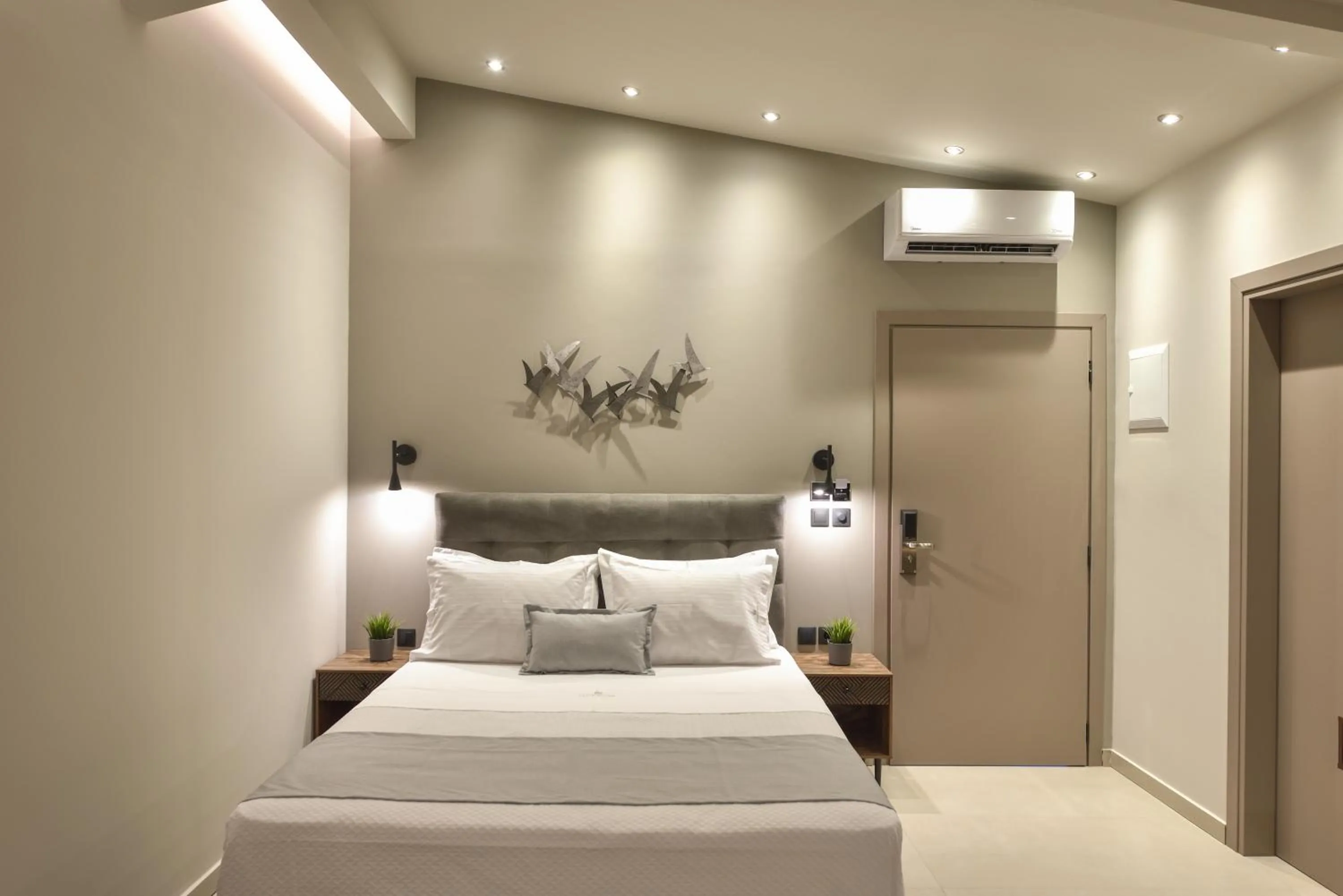 Bed in Olive All-Seasons Suites, Panel Hospitality Homes & Villas