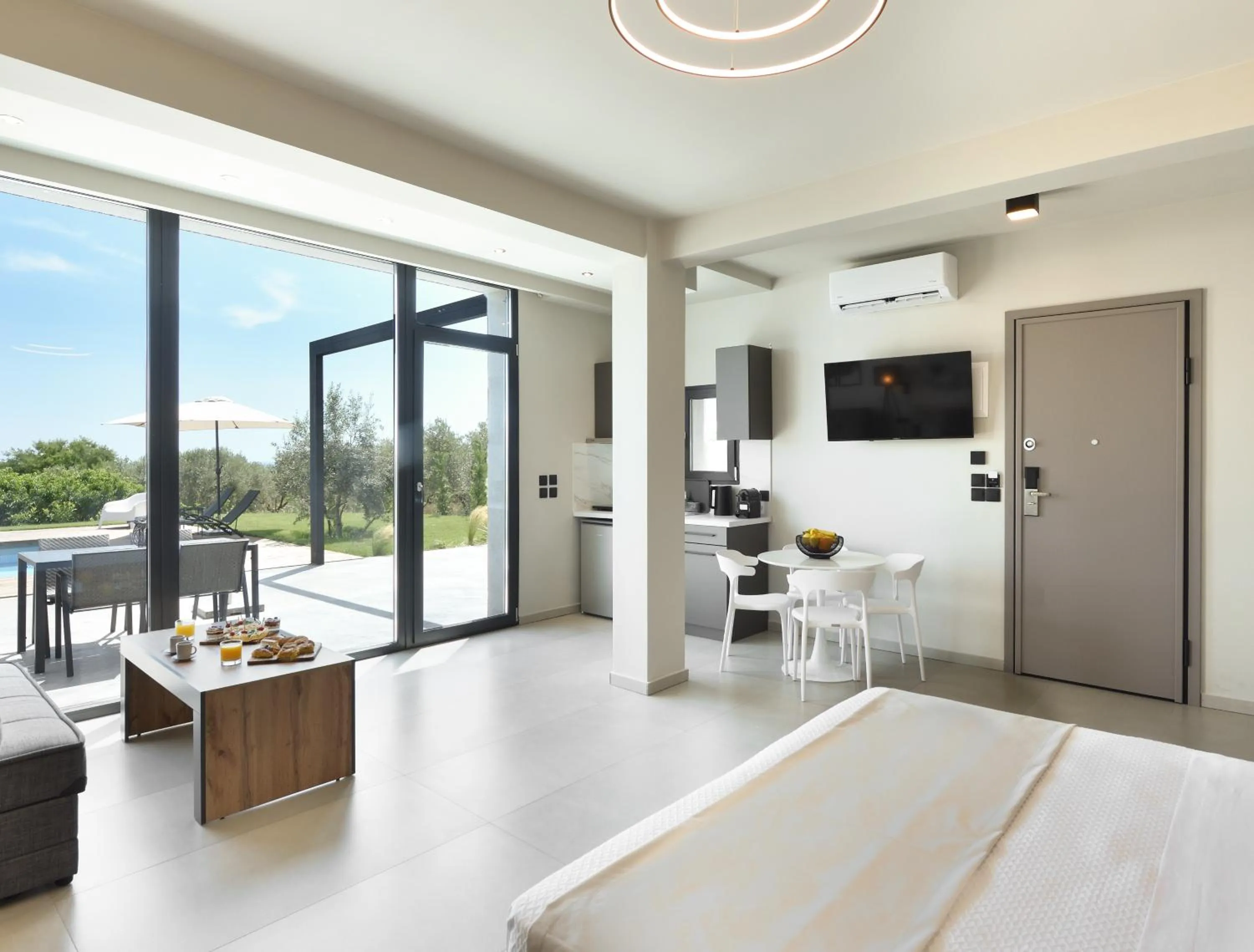 Seating area, Bed in Olive All-Seasons Suites, Panel Hospitality Homes & Villas