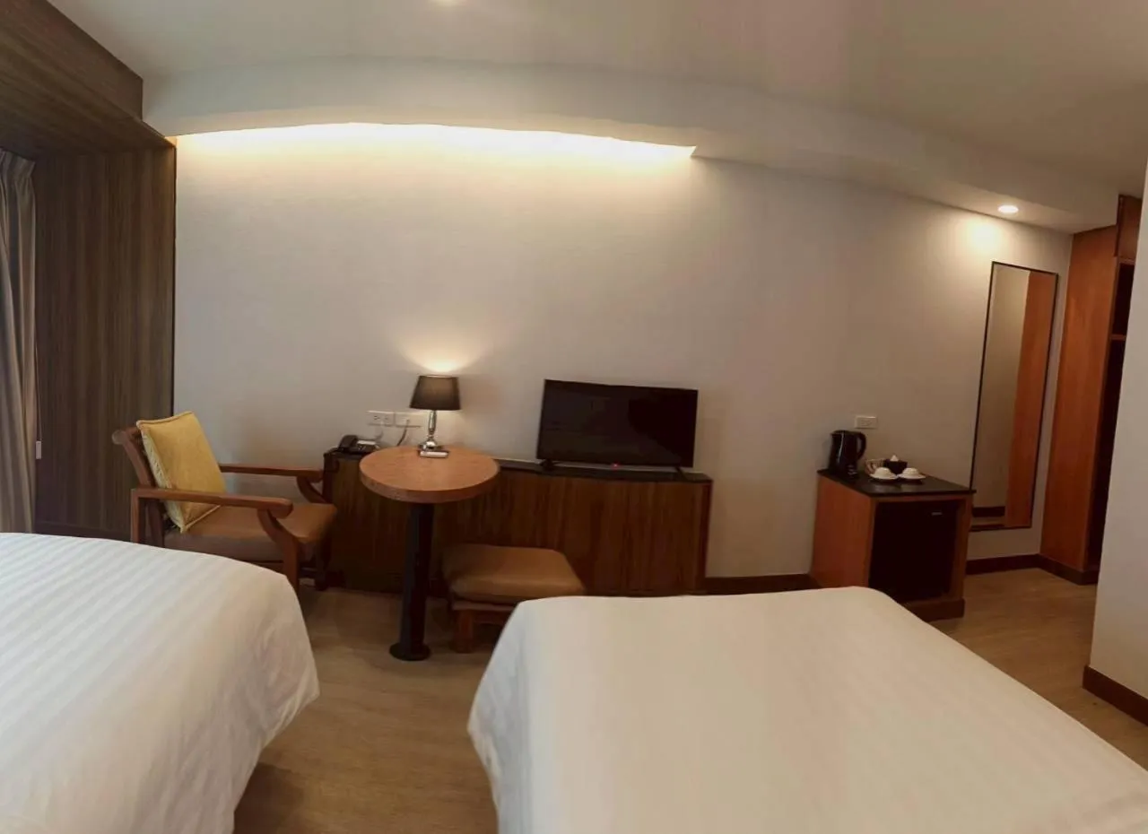 Bed in Cozy Donmueang Hotel