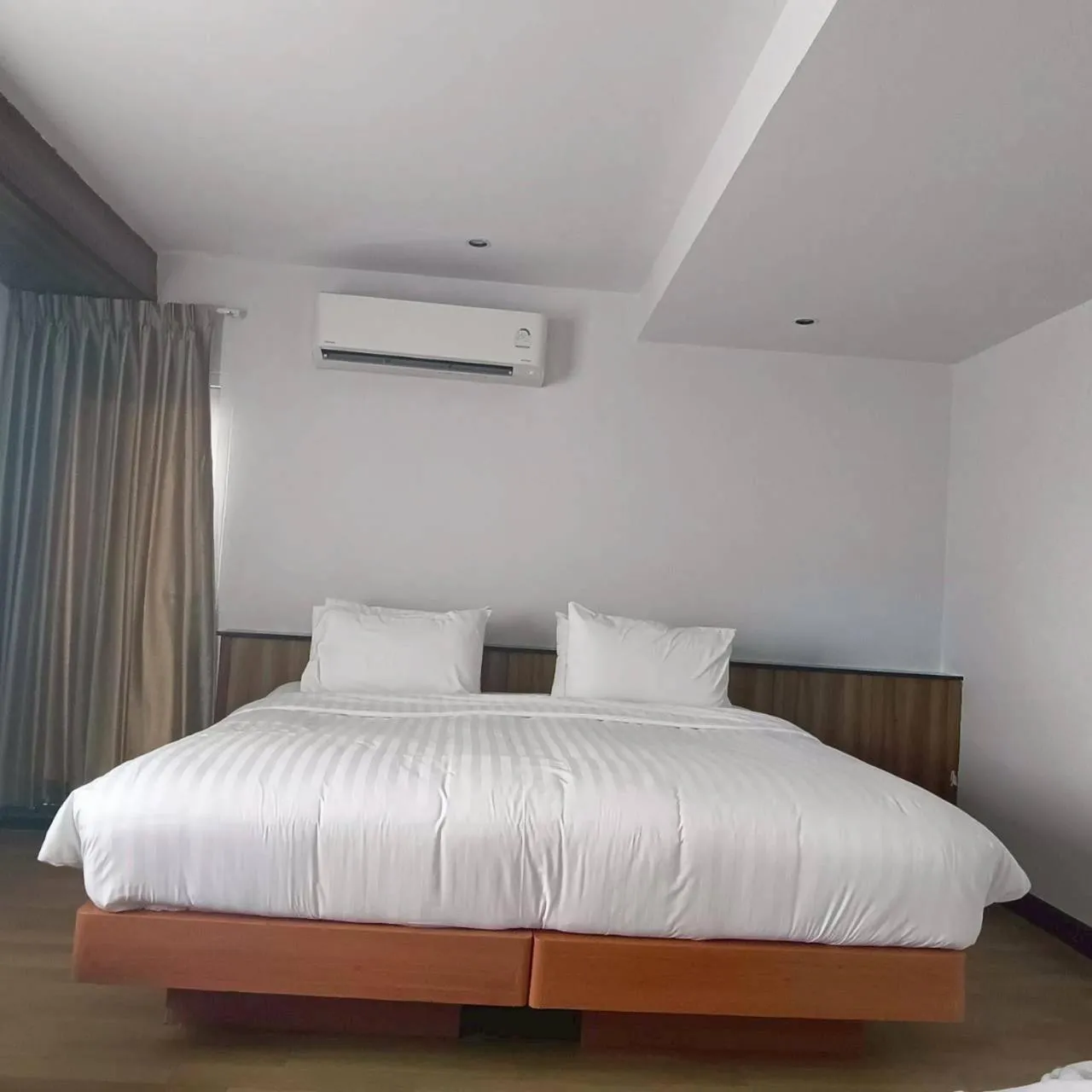 Bed in Cozy Donmueang Hotel