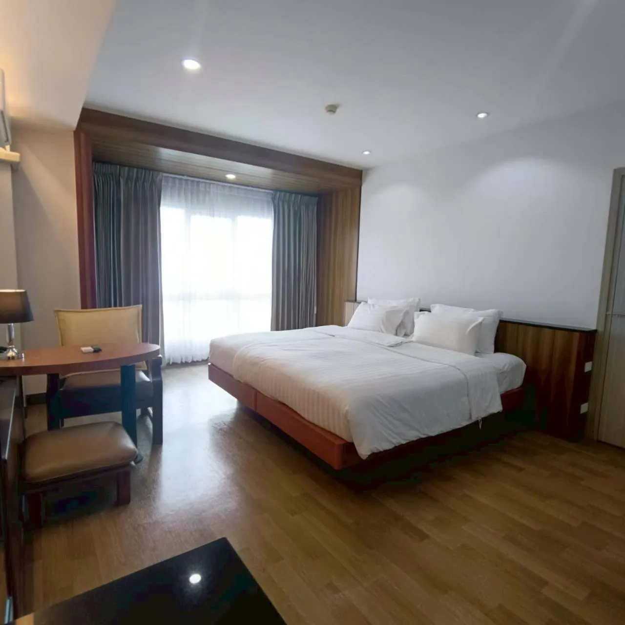 Bed in Cozy Donmueang Hotel