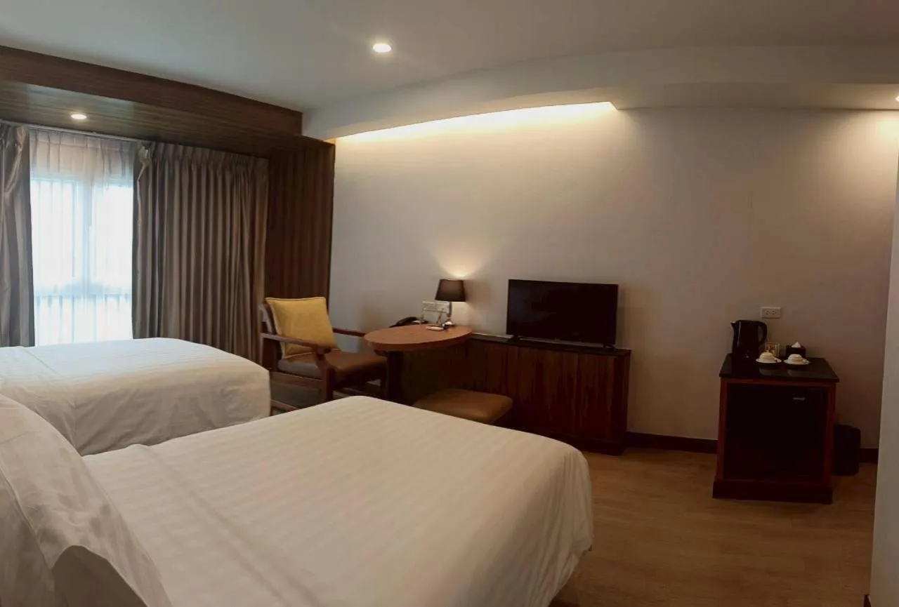 Bed in Cozy Donmueang Hotel