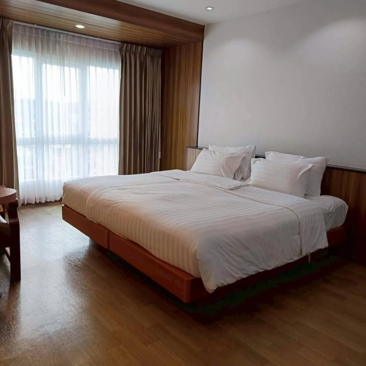 Bed in Cozy Donmueang Hotel