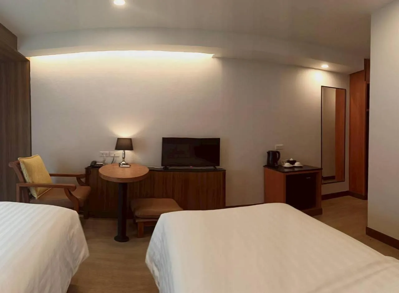 Bed in Cozy Donmueang Hotel