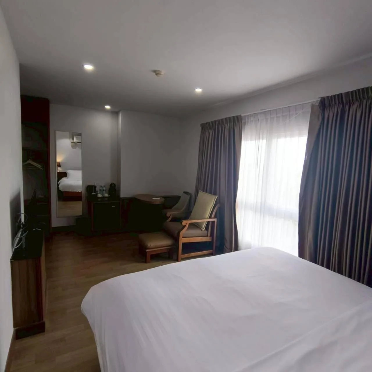 Bed in Cozy Donmueang Hotel