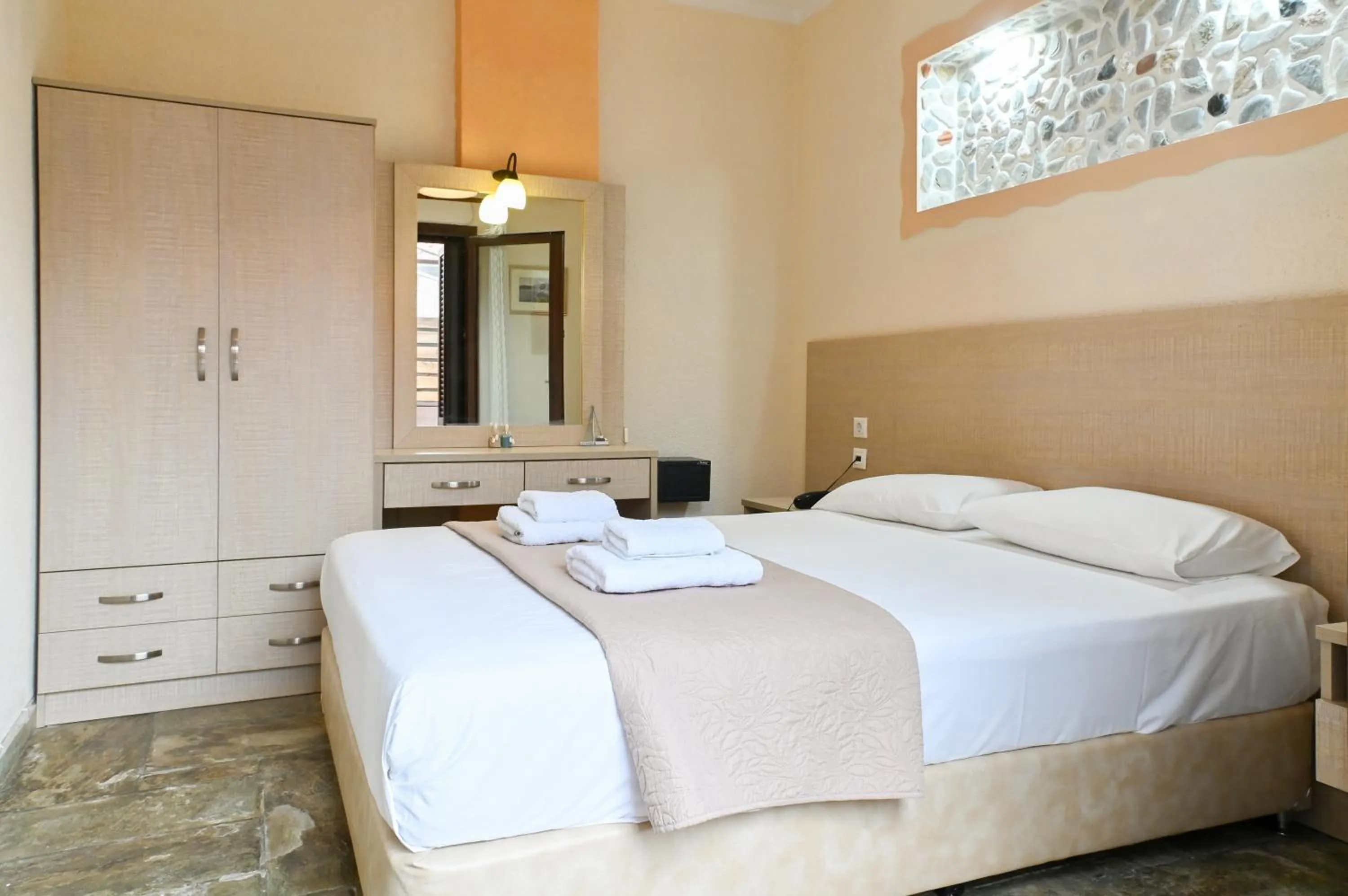 Bed in Agnanti Hotel Apartments