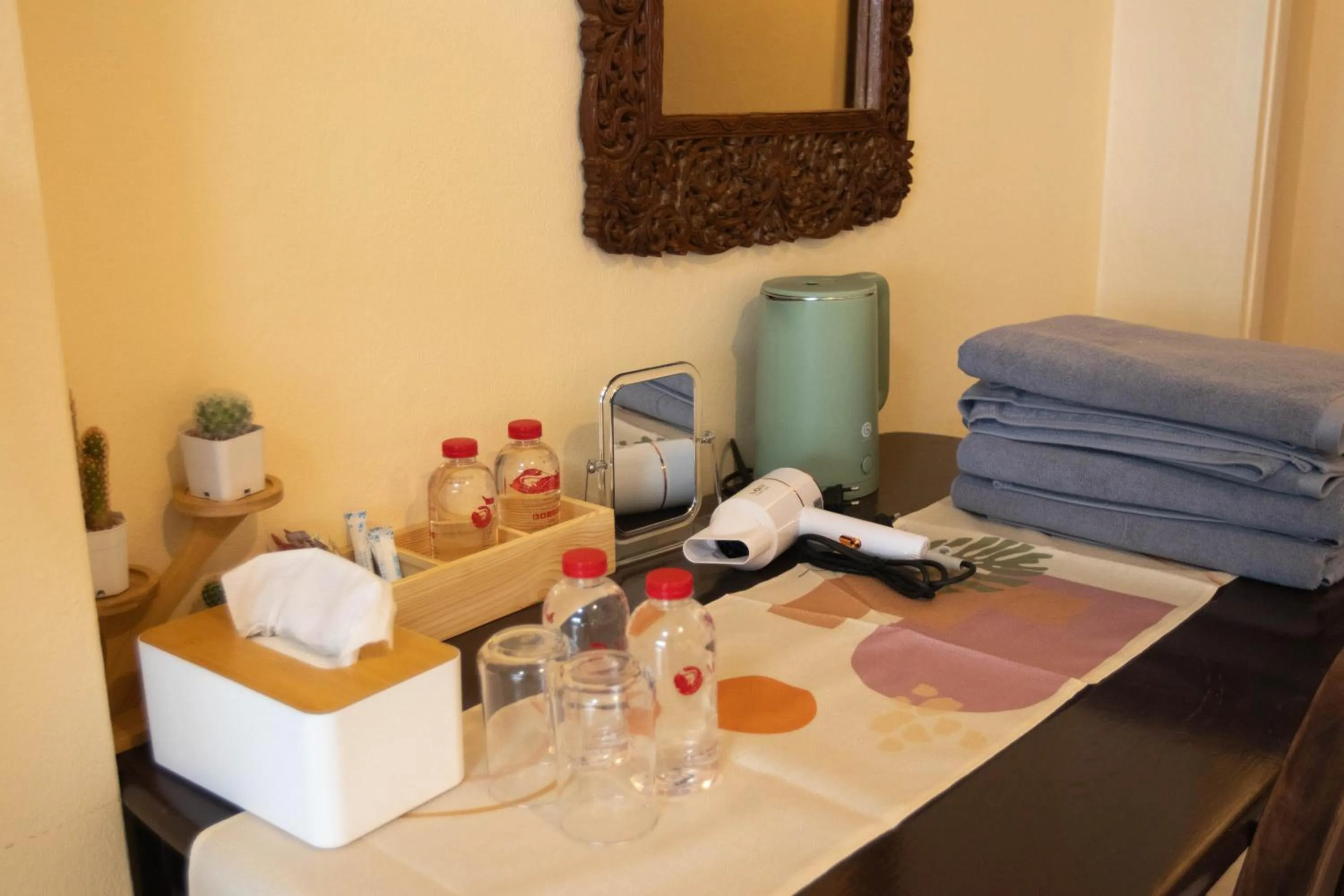 towels in Maiiam Guesthouse Patong