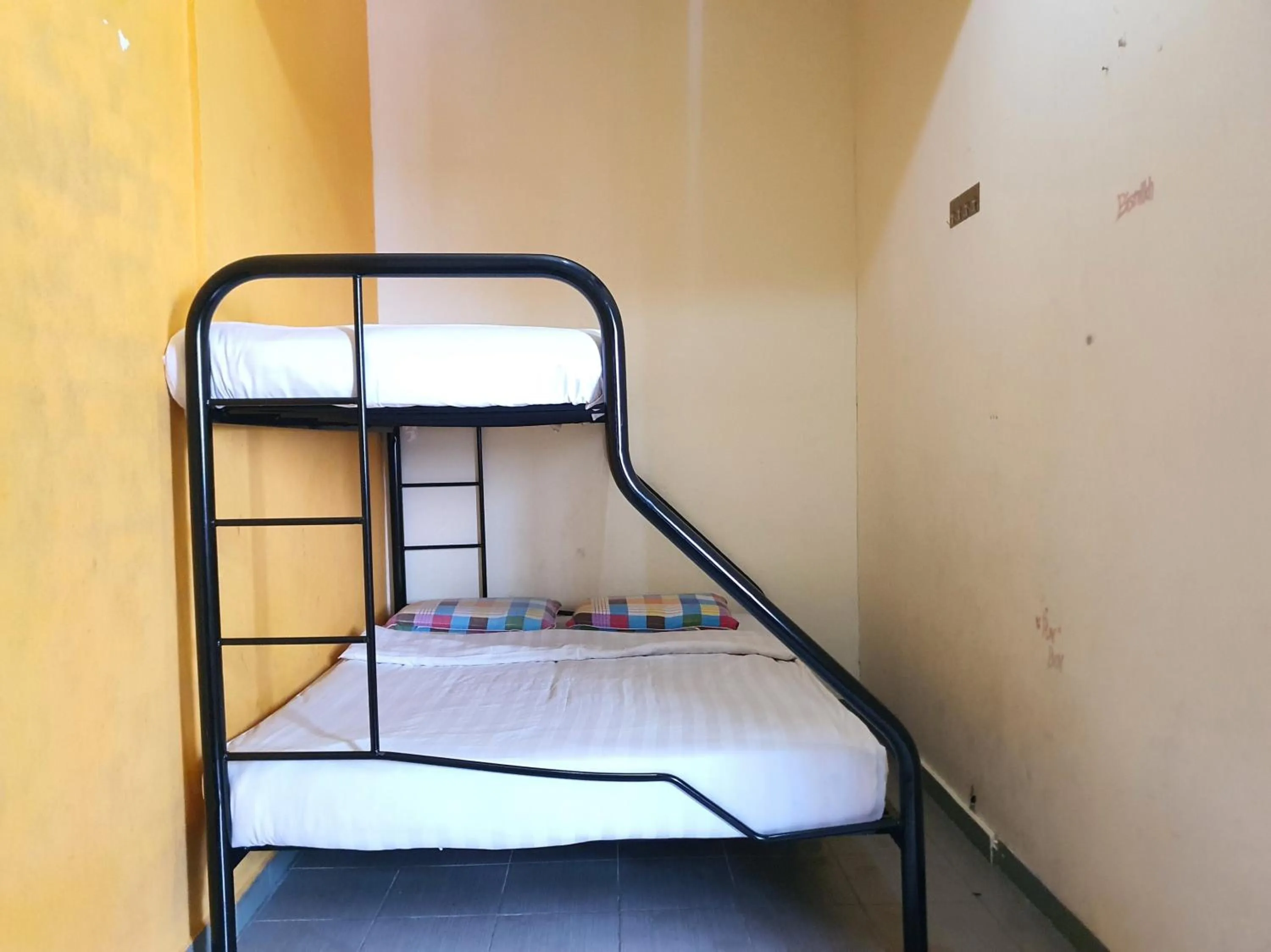 Bedroom in SPOT ON 90984 Gn Homestay