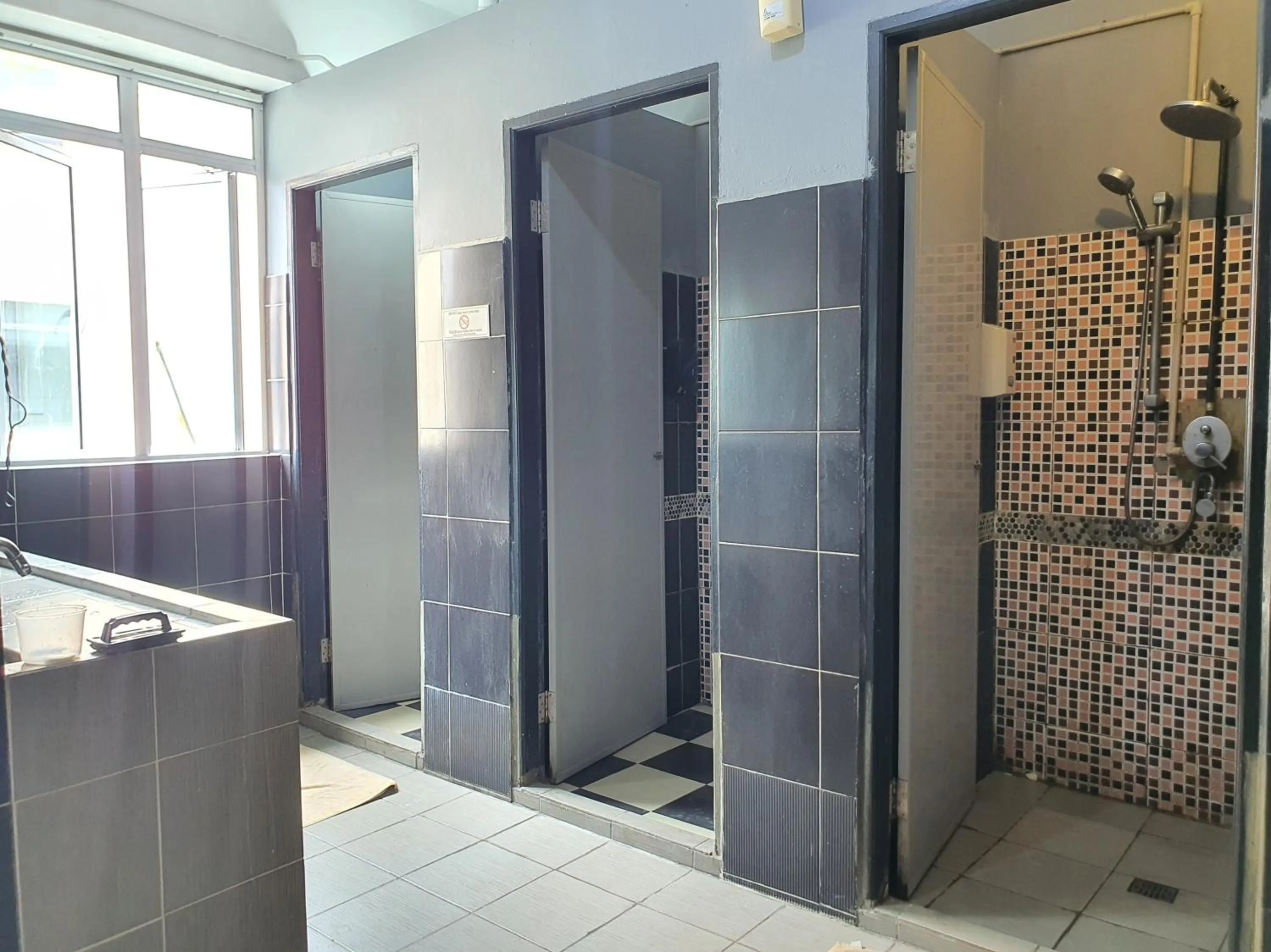 Bathroom in SPOT ON 90984 Gn Homestay