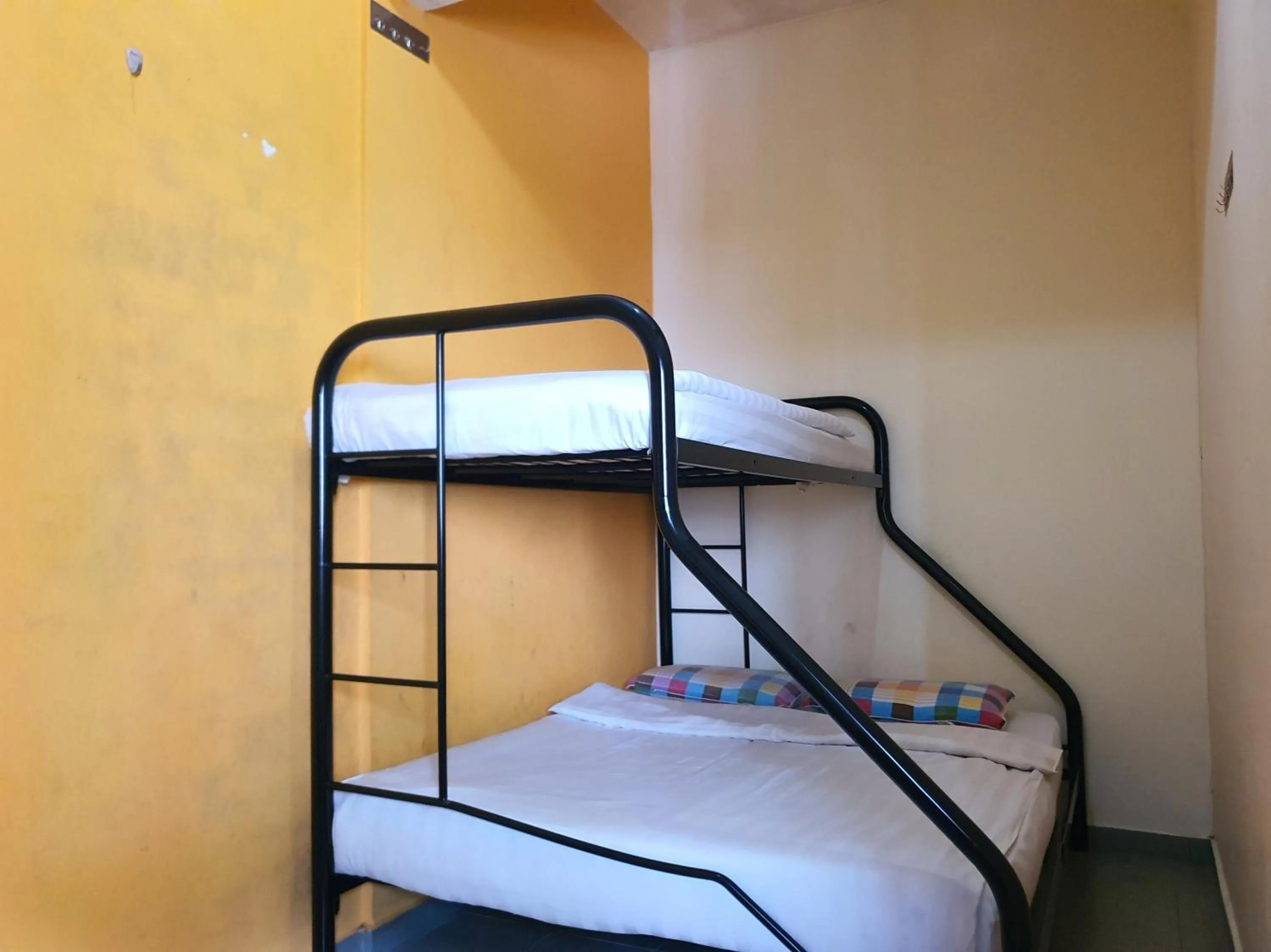 Bedroom in SPOT ON 90984 Gn Homestay