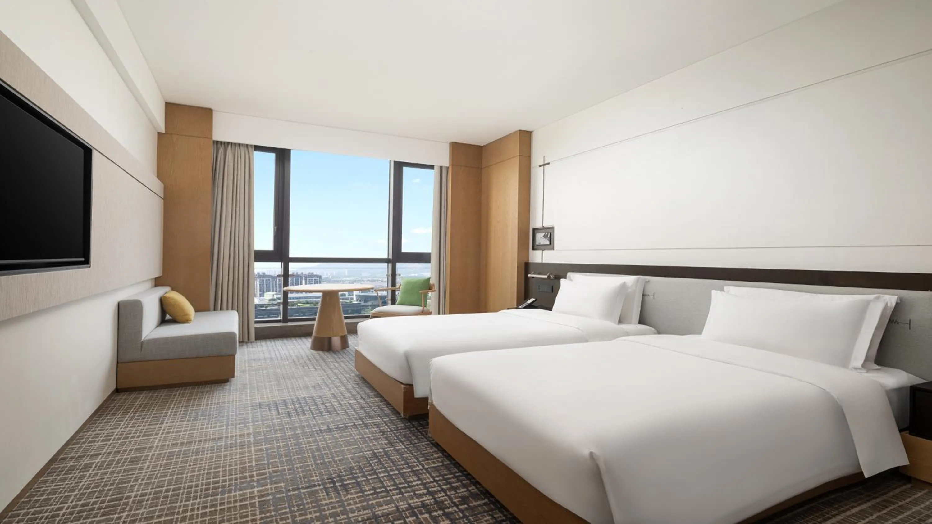 Bed in Holiday Inn Ningbo Xiangshan Damu Bay by IHG