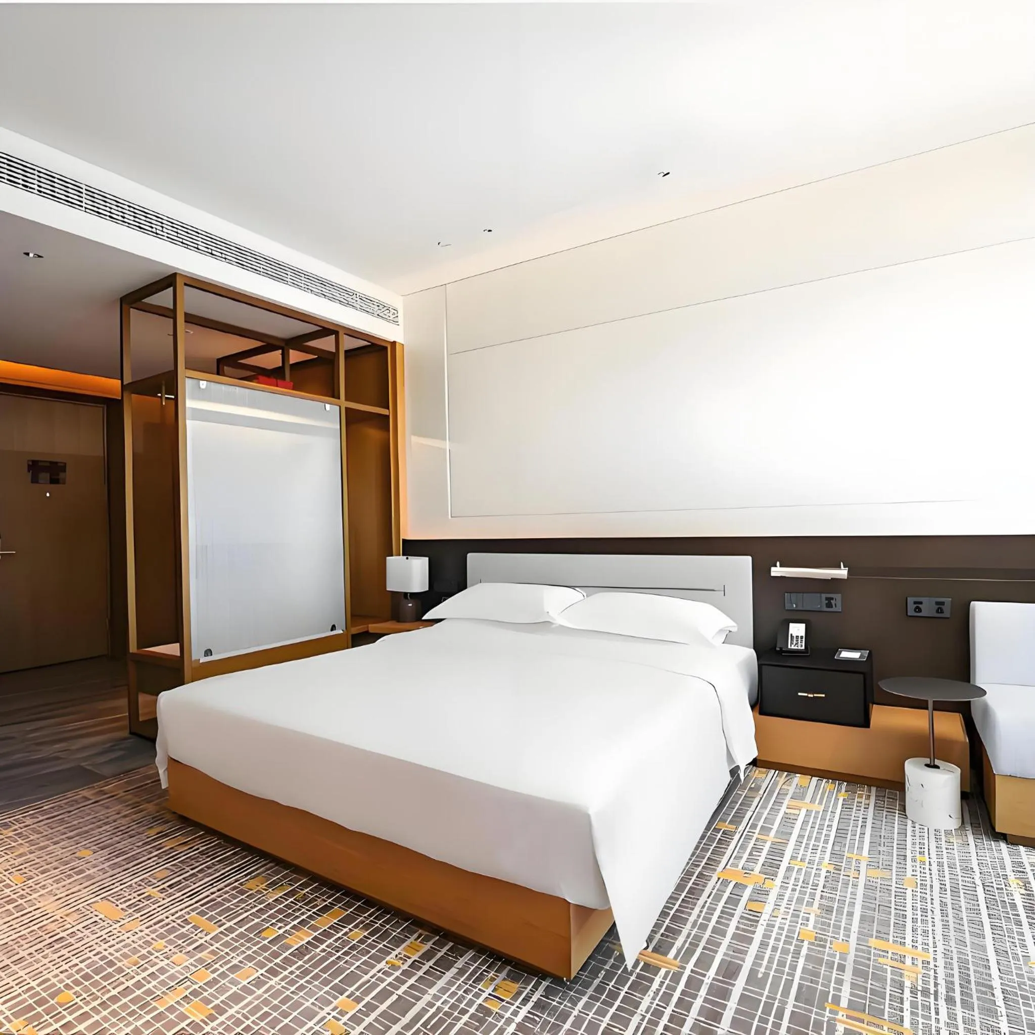 Photo of the whole room, Bed in Holiday Inn Ningbo Xiangshan Damu Bay by IHG