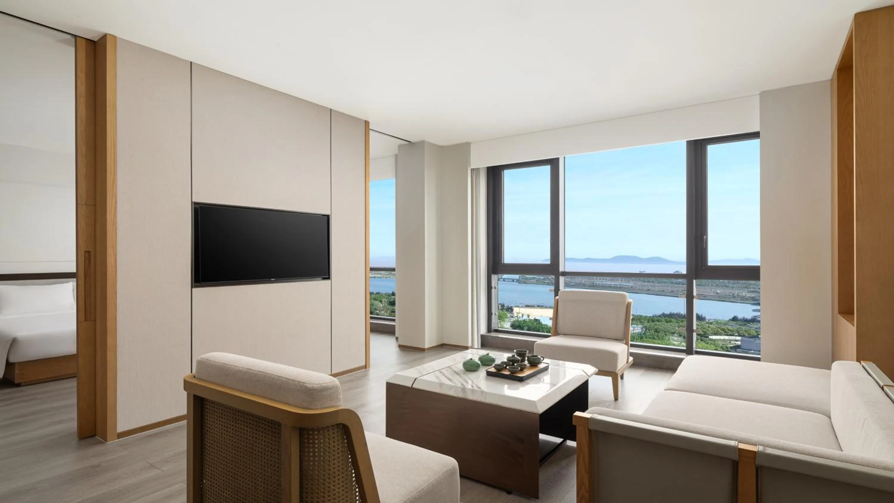 Living room in Holiday Inn Ningbo Xiangshan Damu Bay by IHG