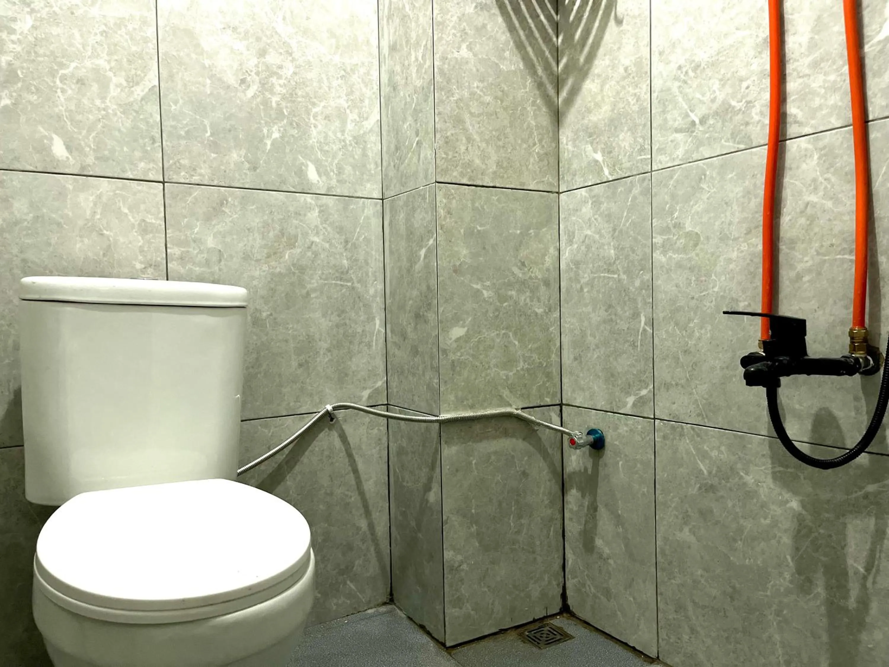 Bathroom in Urbanview De Path House Syariah Boyolali