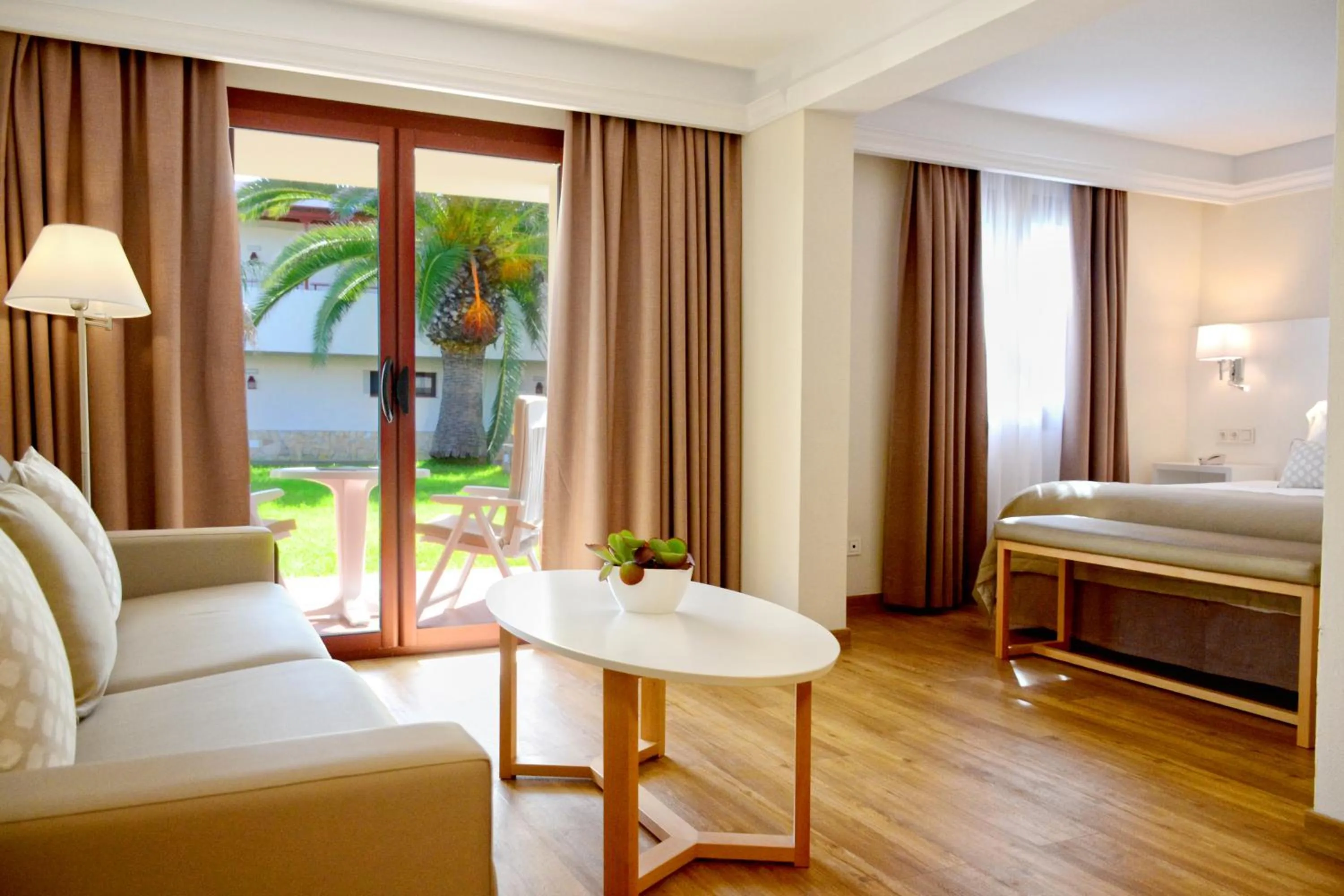 Seating area, Bed in Alua Suites Fuerteventura - All Inclusive