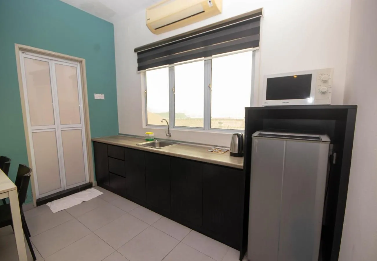Kitchen or kitchenette in JQ Osborne Apartment