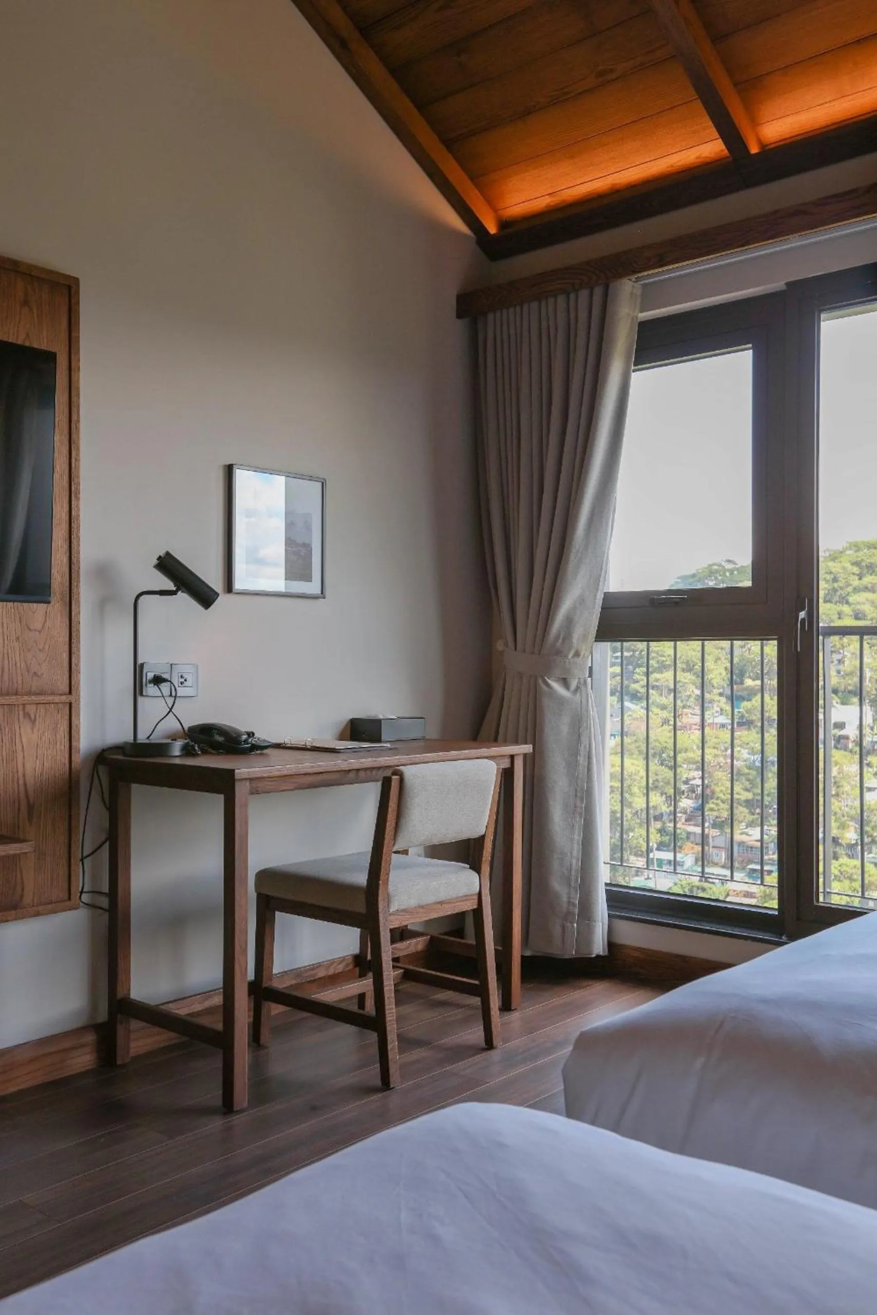 Seating area, Bed in HLS Dalat Lodge