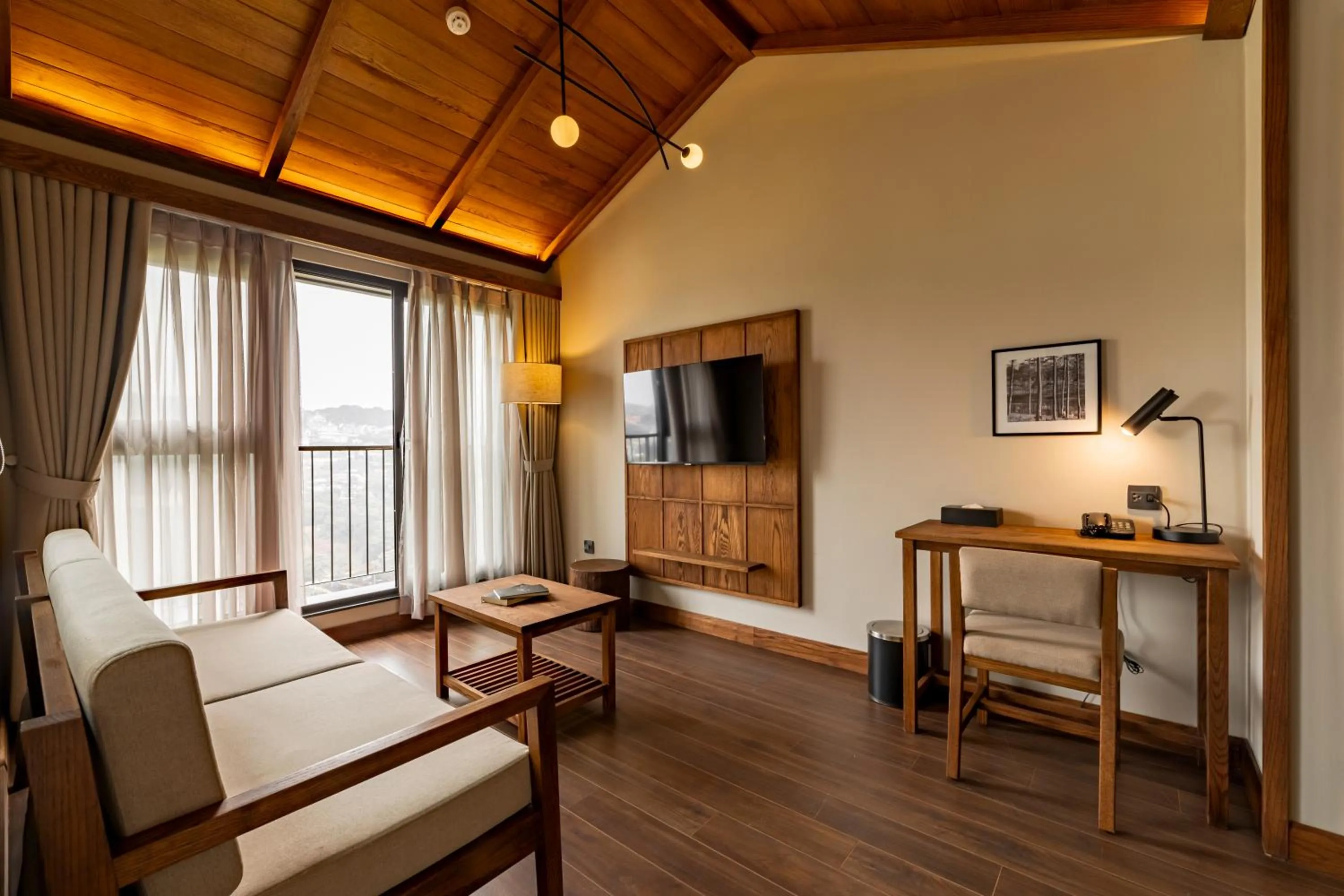 Communal lounge/ TV room in HLS Dalat Lodge