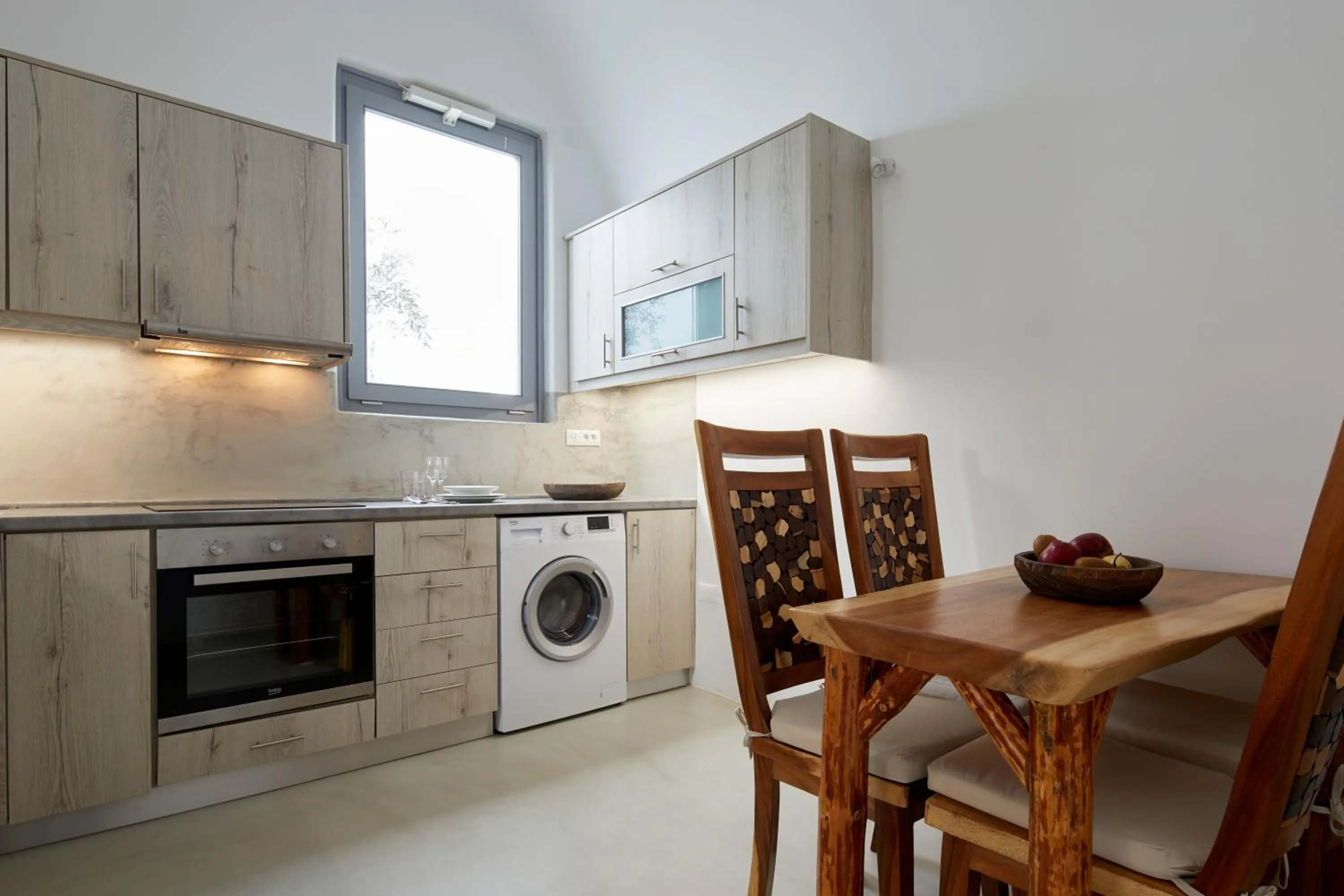 Kitchen or kitchenette in Iliovasilema Suites