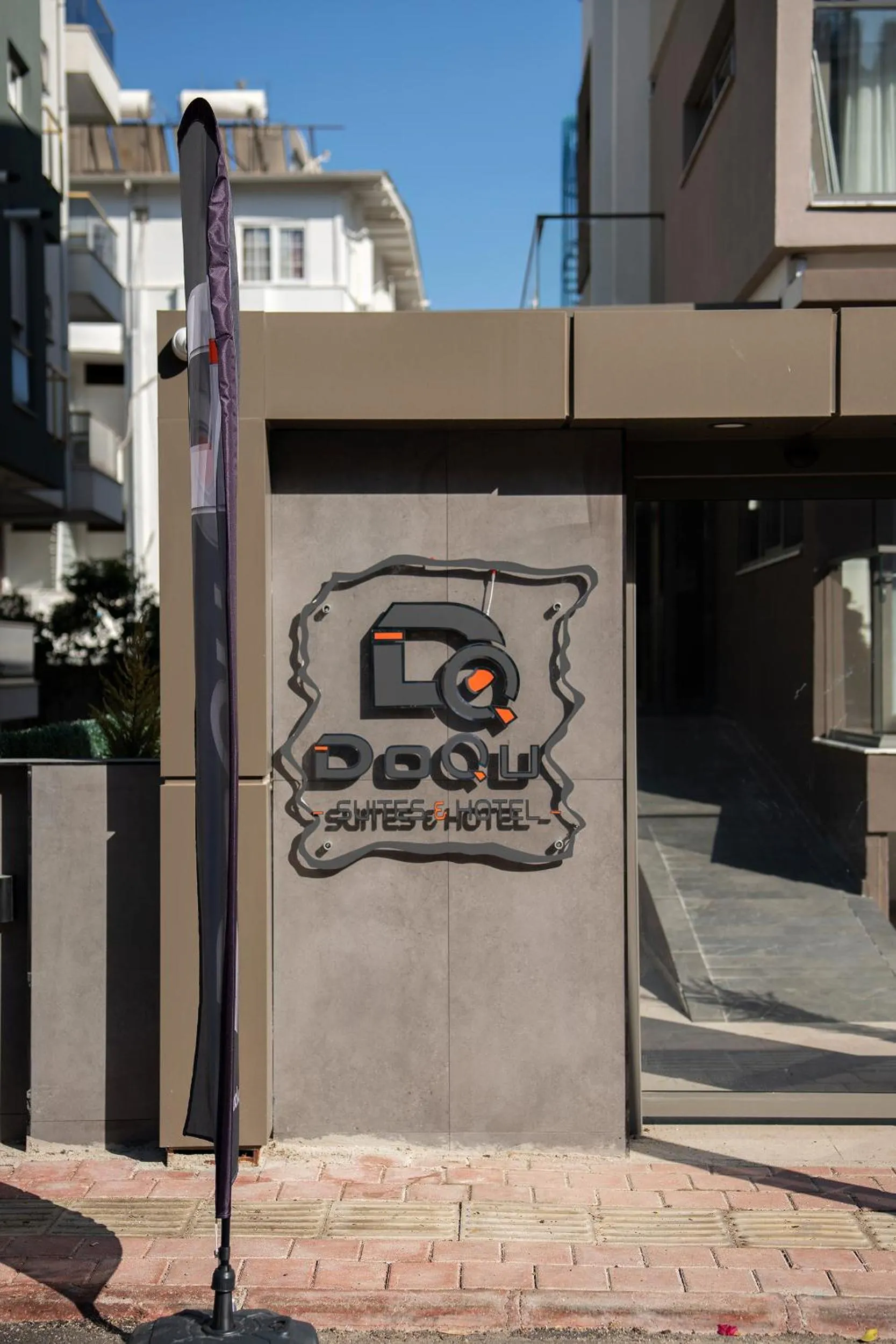 Property logo or sign in Doqu Suites Hotel