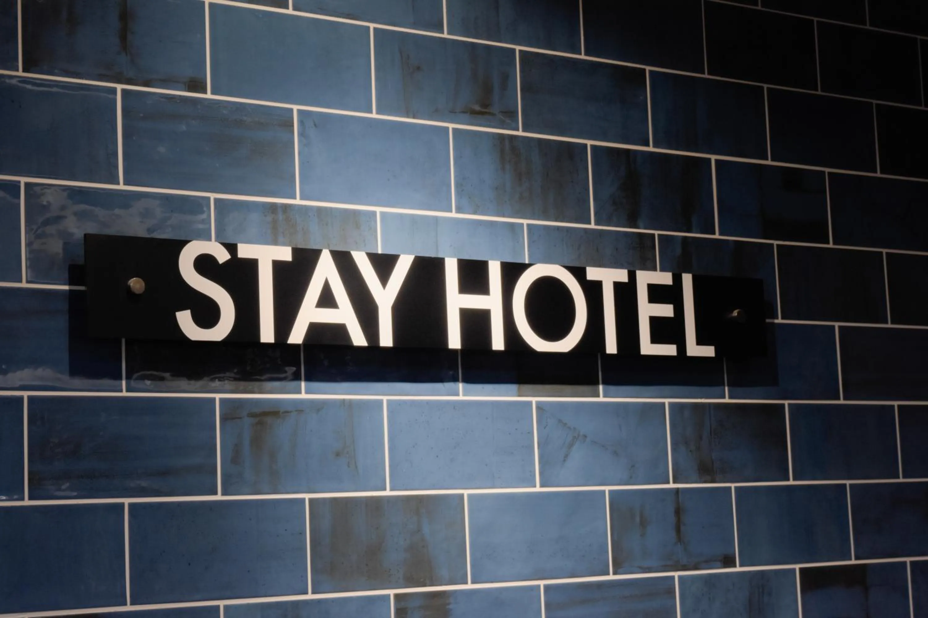 Property logo or sign in Stay HOTEL