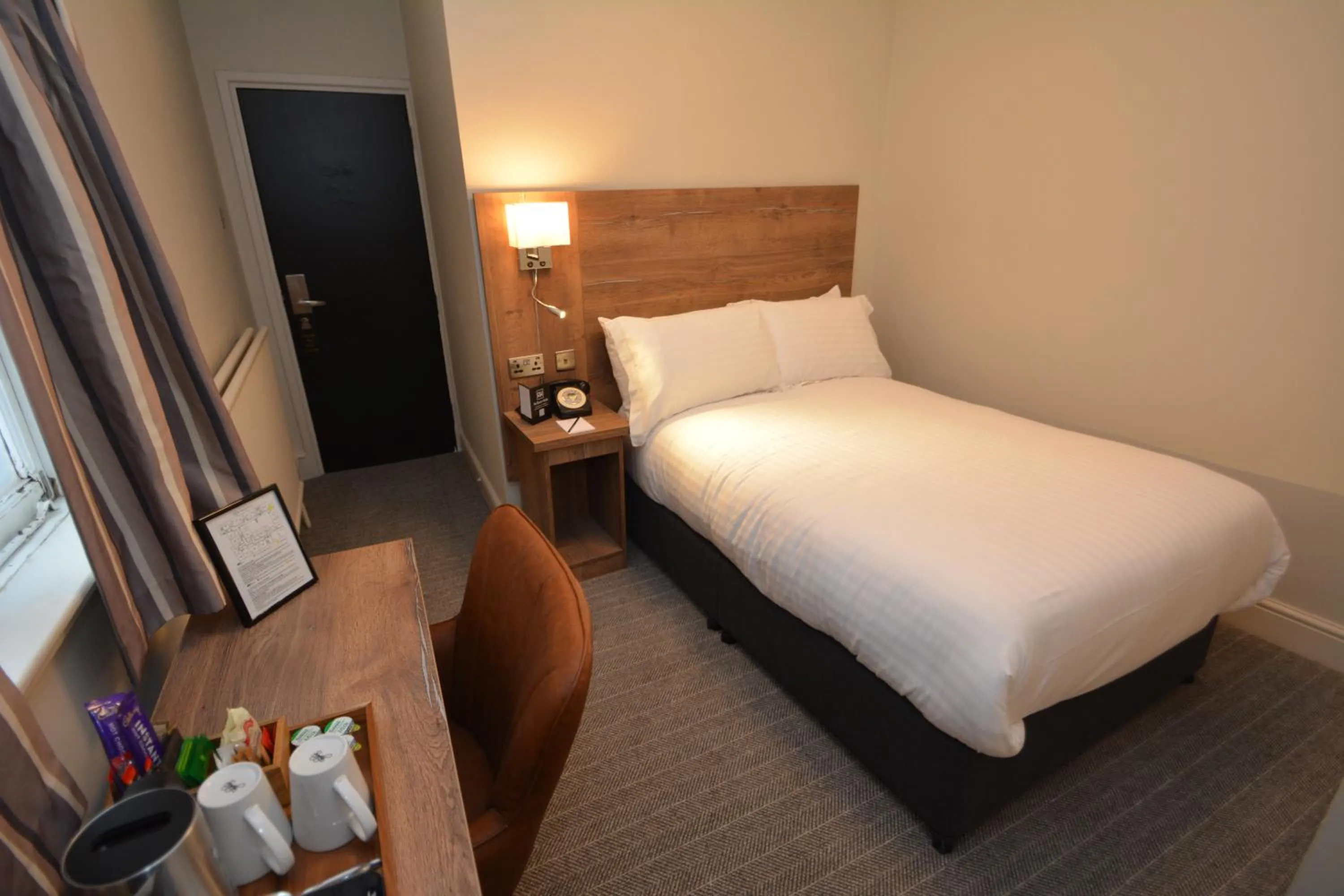 Bed in The Rugby Hotel