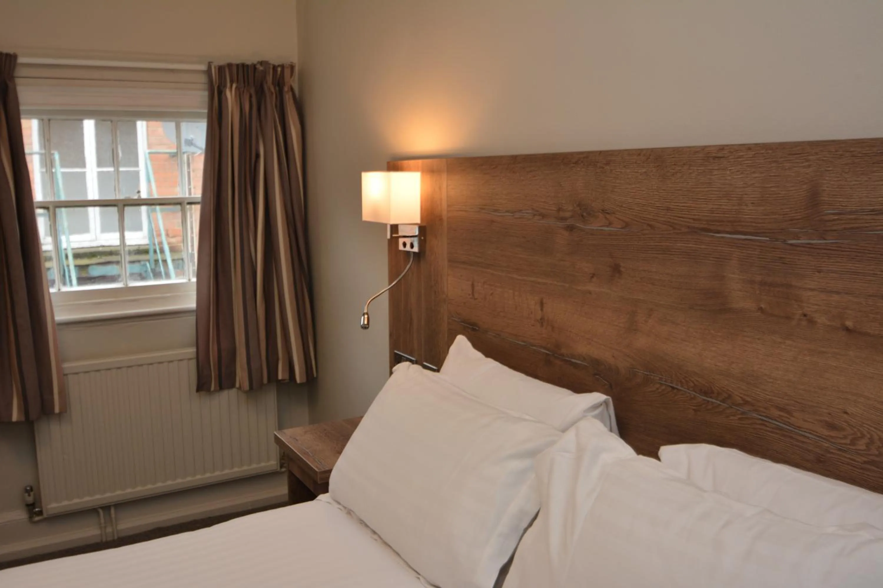 Bed in The Rugby Hotel