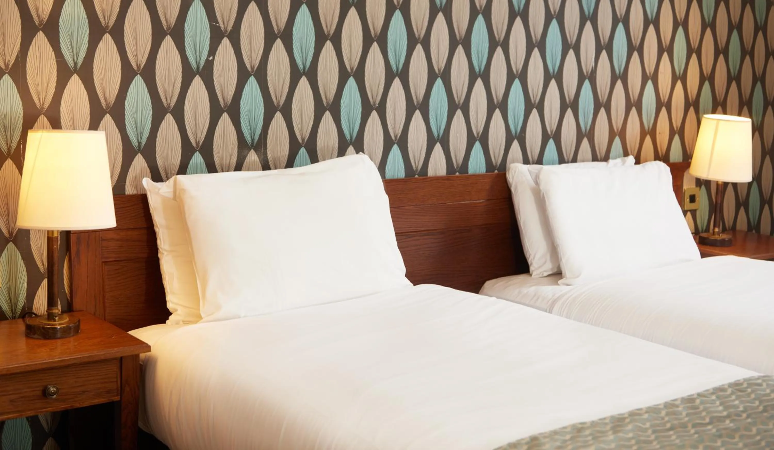 Bed in Cock Hotel by Greene King Inns