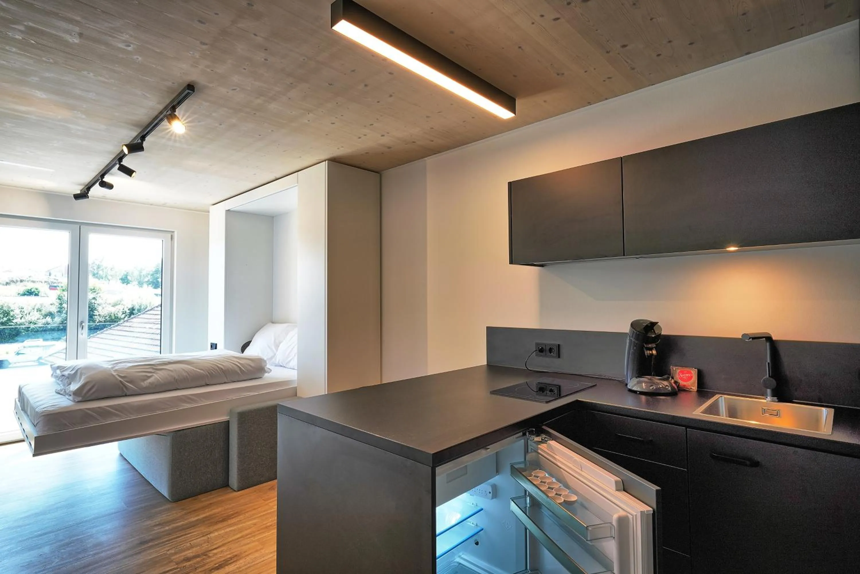 Kitchen or kitchenette, Bed in Timber One Boardinghouse Dorfen