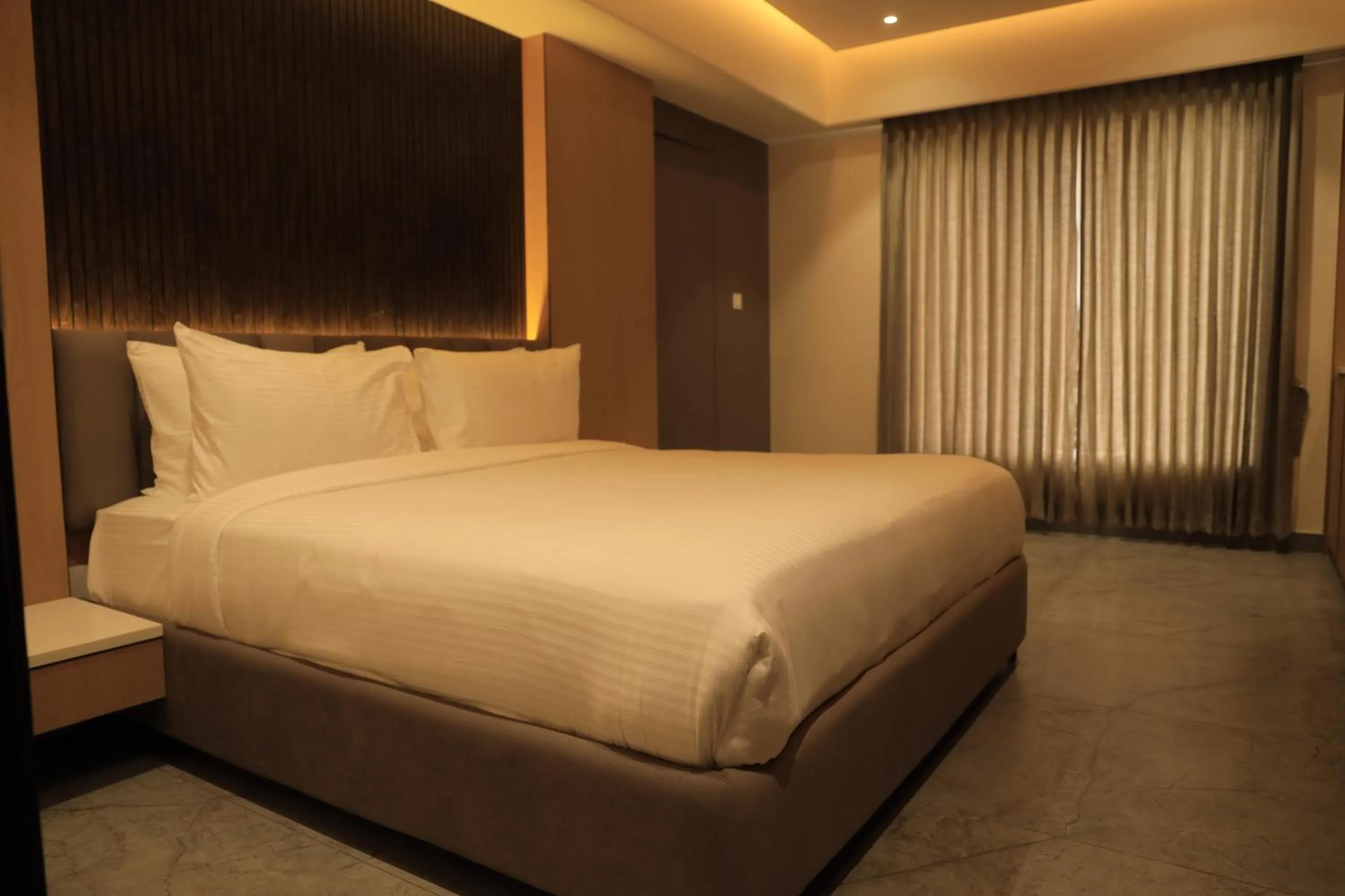 Bed in VANTARA SUITEs