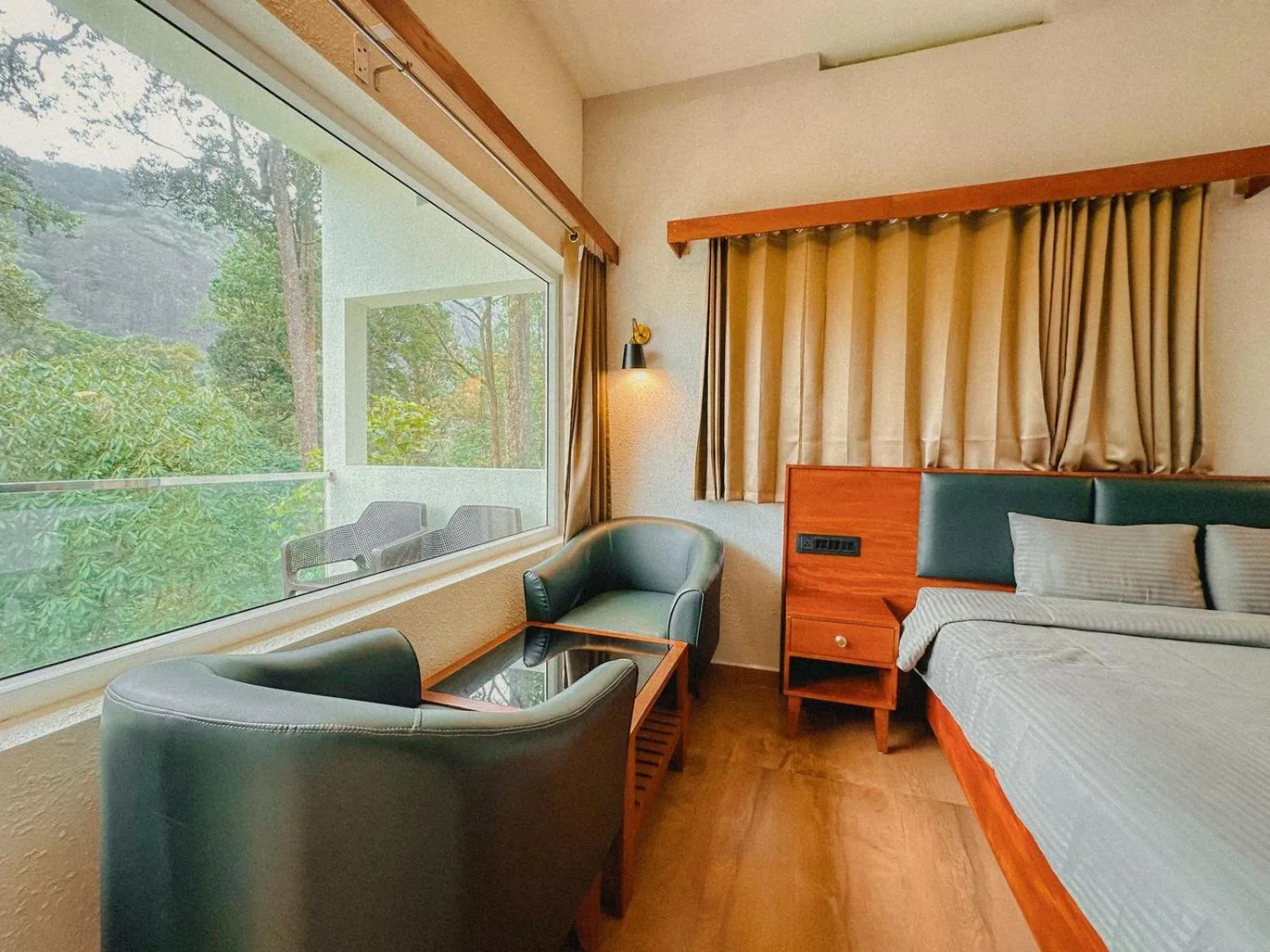 Seating area, Bed in Forestscape Resort Munnar