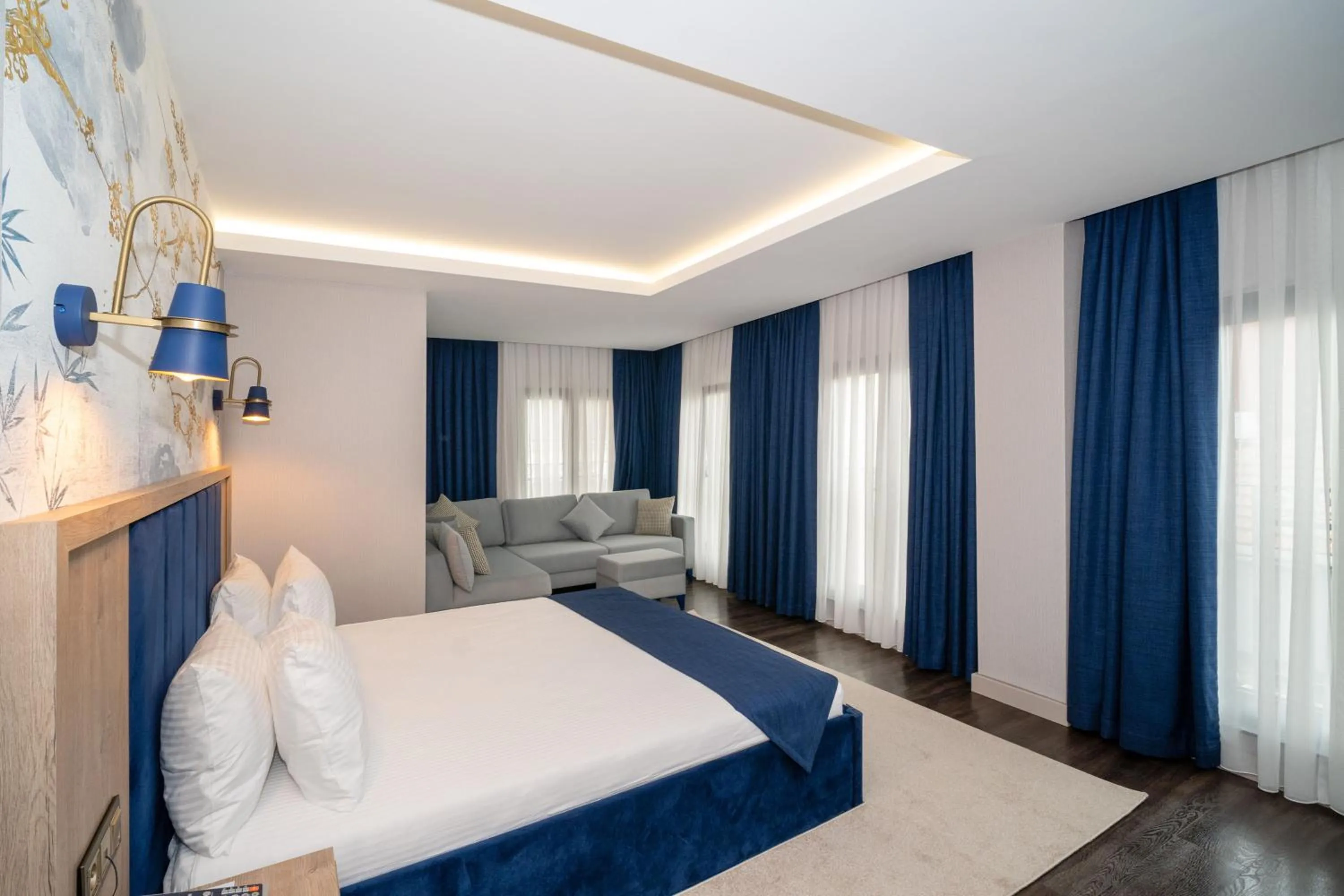 Seating area, Bed in Querencia Hotel