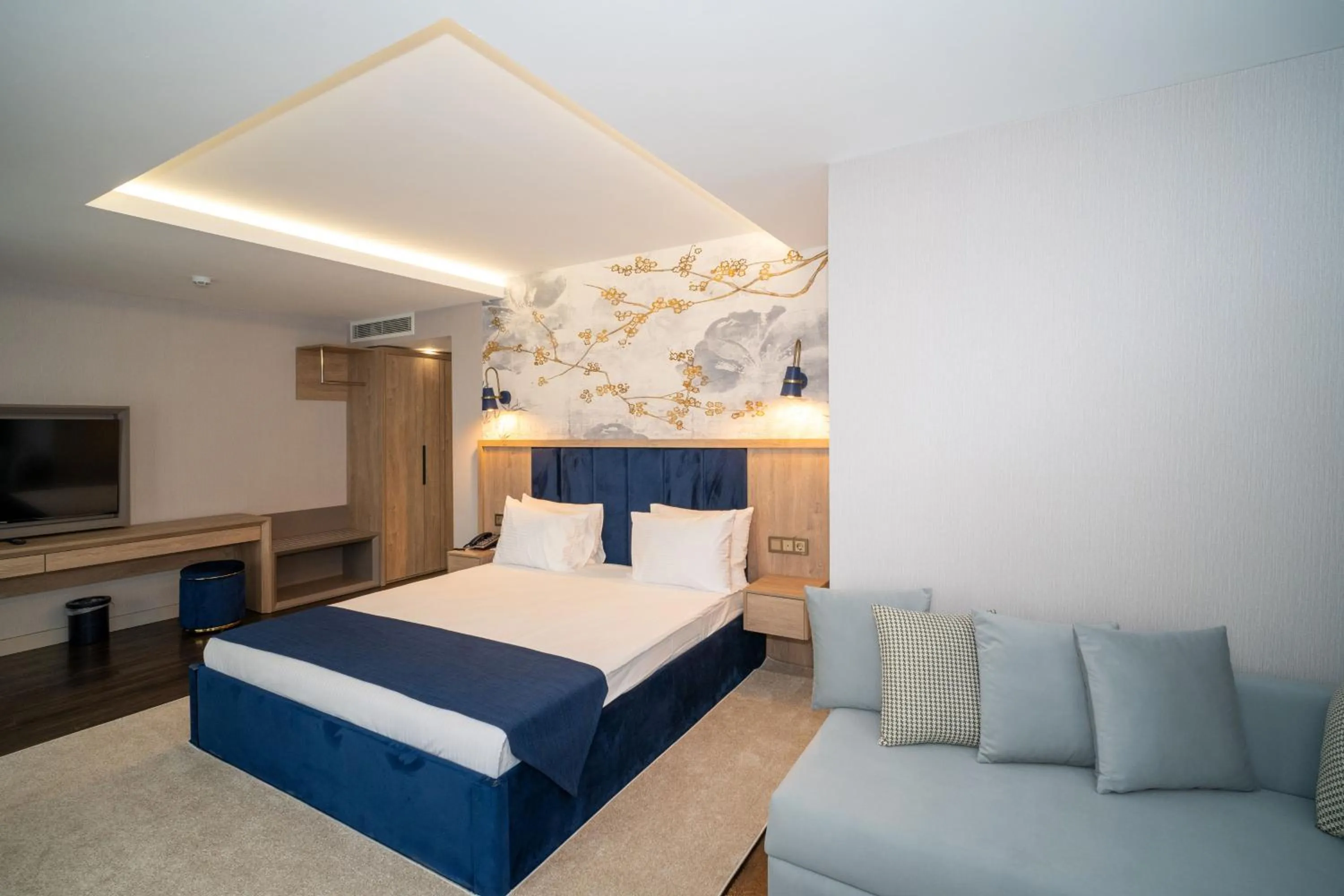 Seating area, Bed in Querencia Hotel