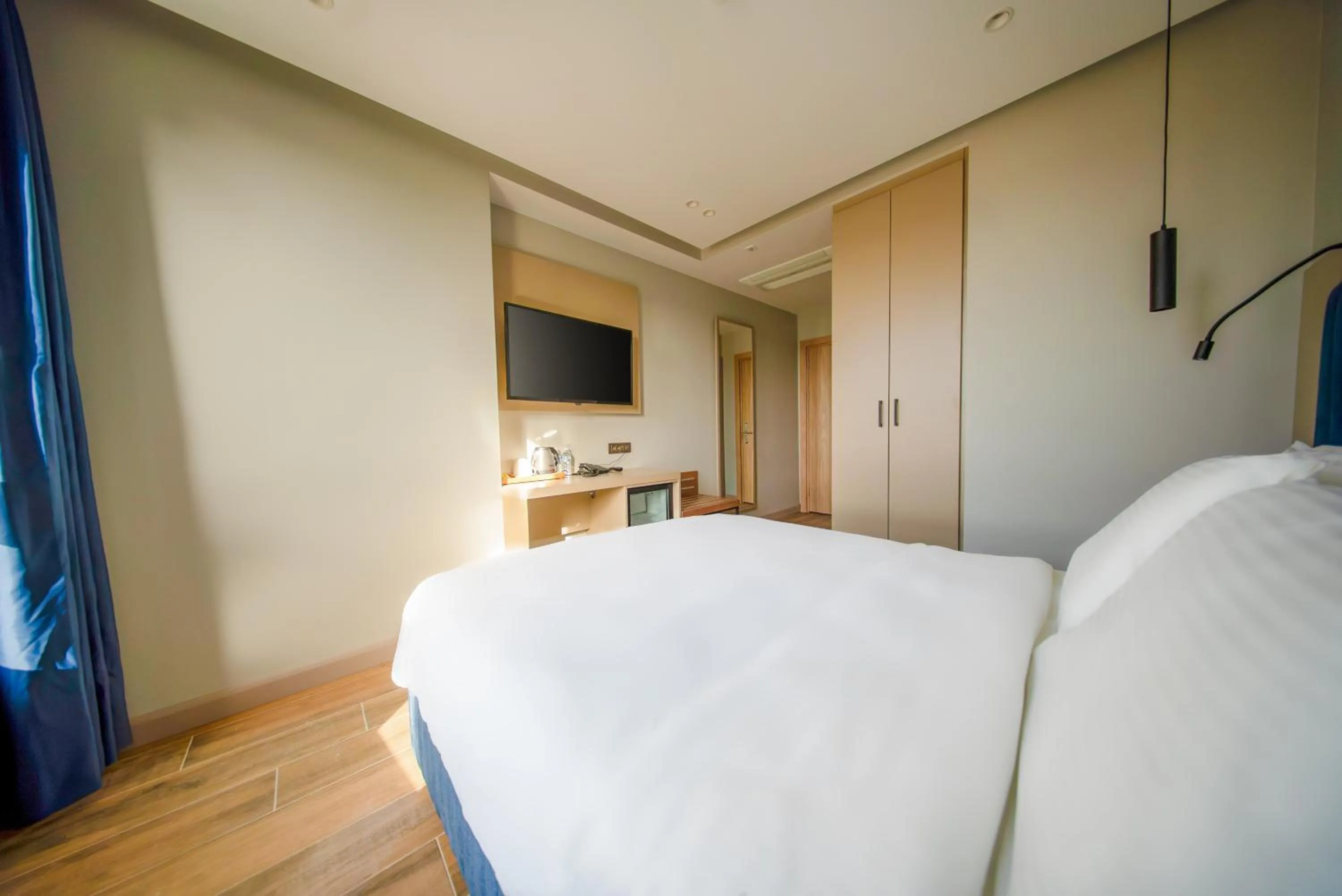 Bed in The Palm Bosphorus Hotel