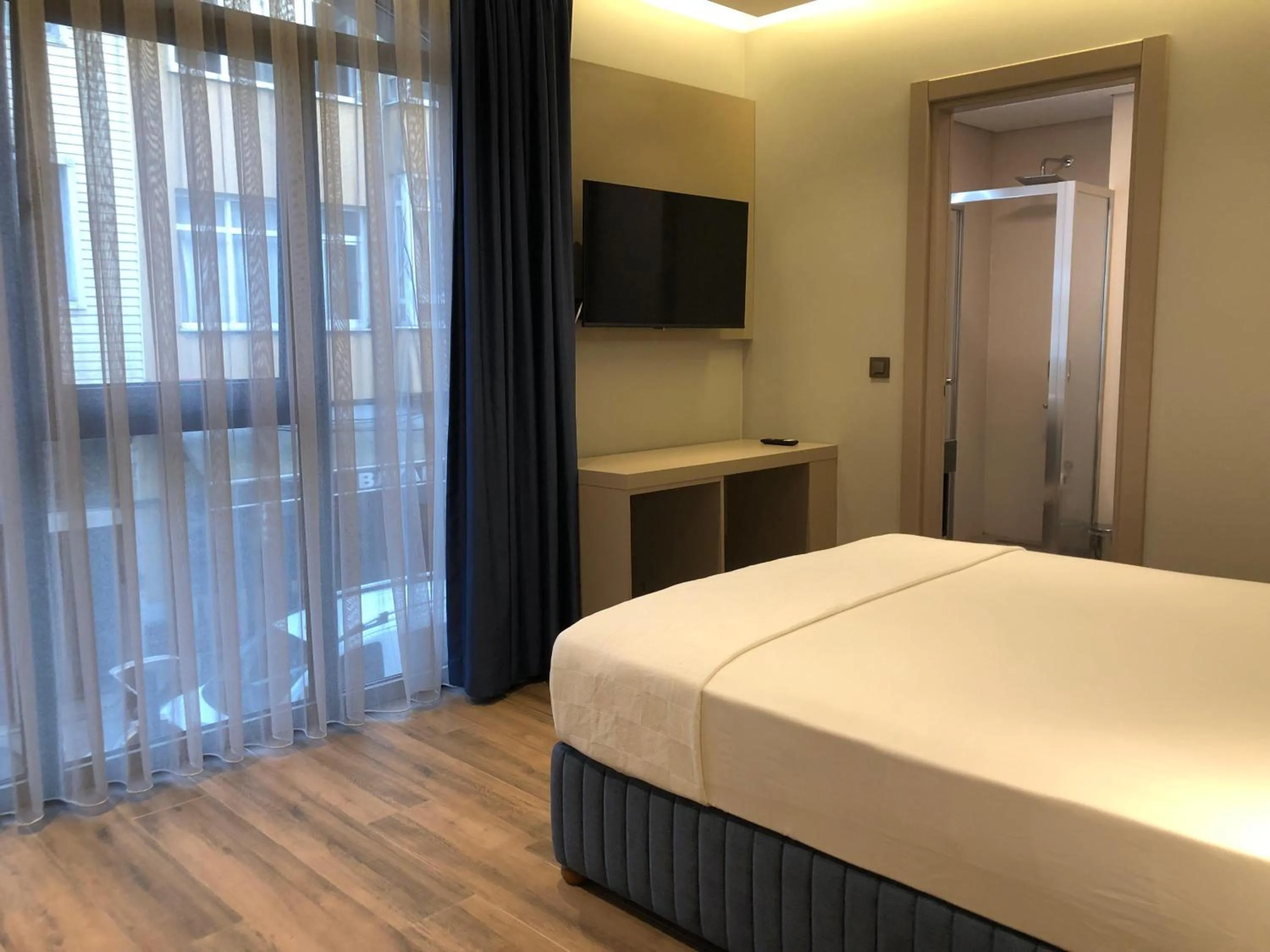 Bed in The Palm Bosphorus Hotel