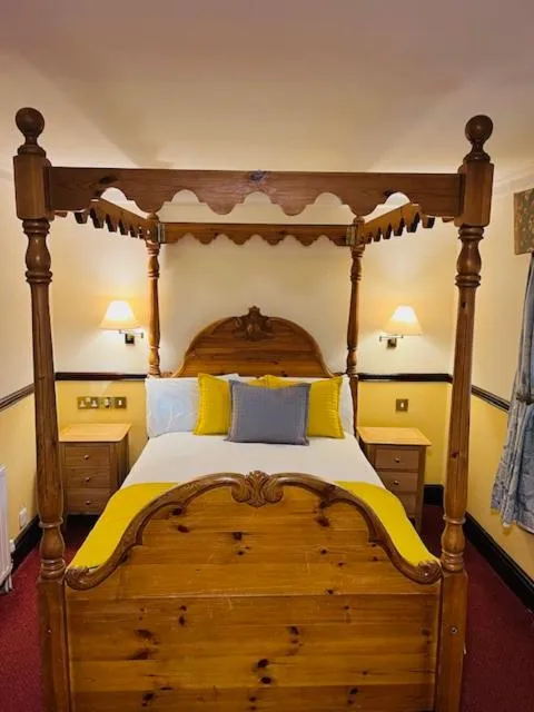 Bed in Crown & Cushion Hotel