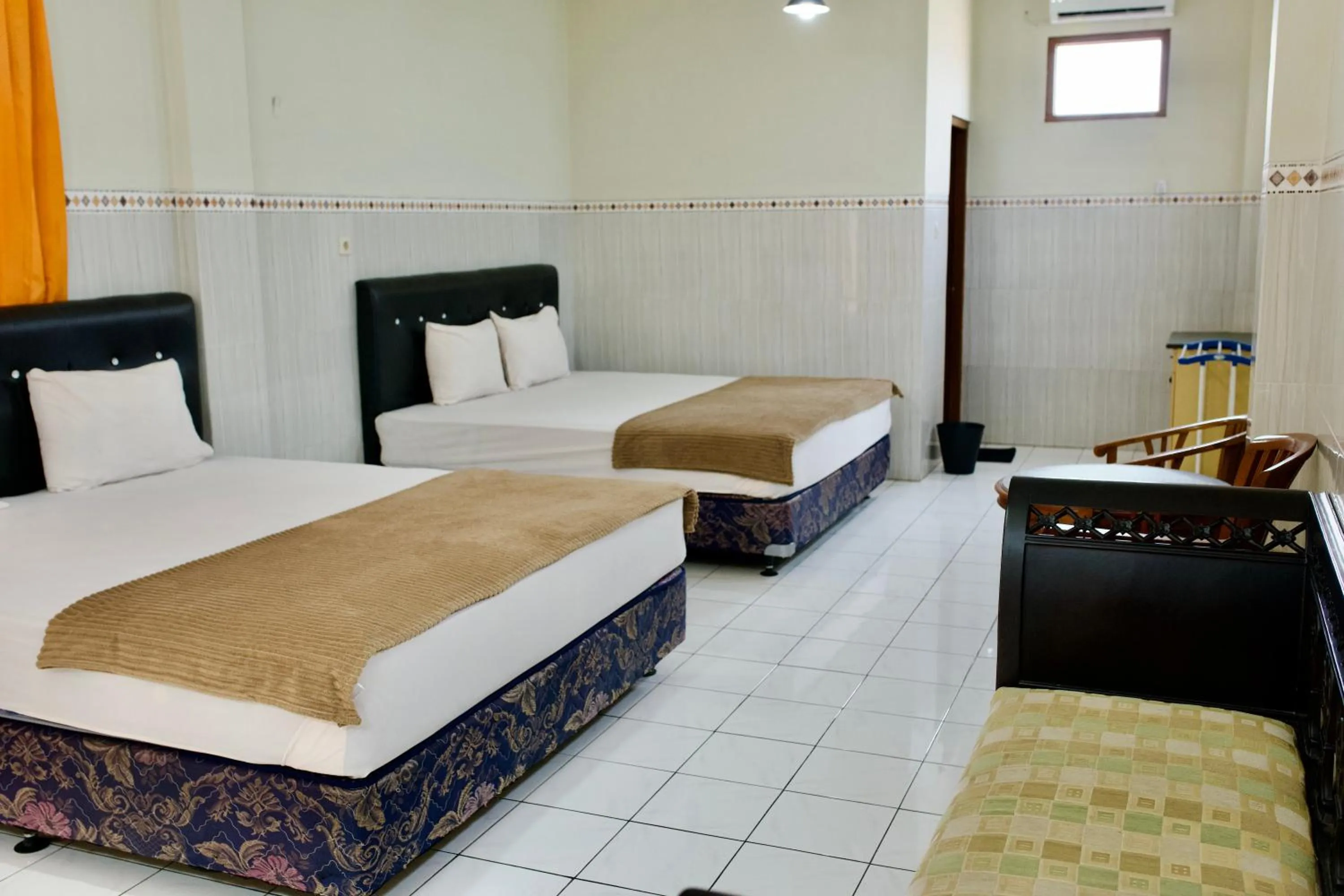 Bed in Garuda Setia Hotel