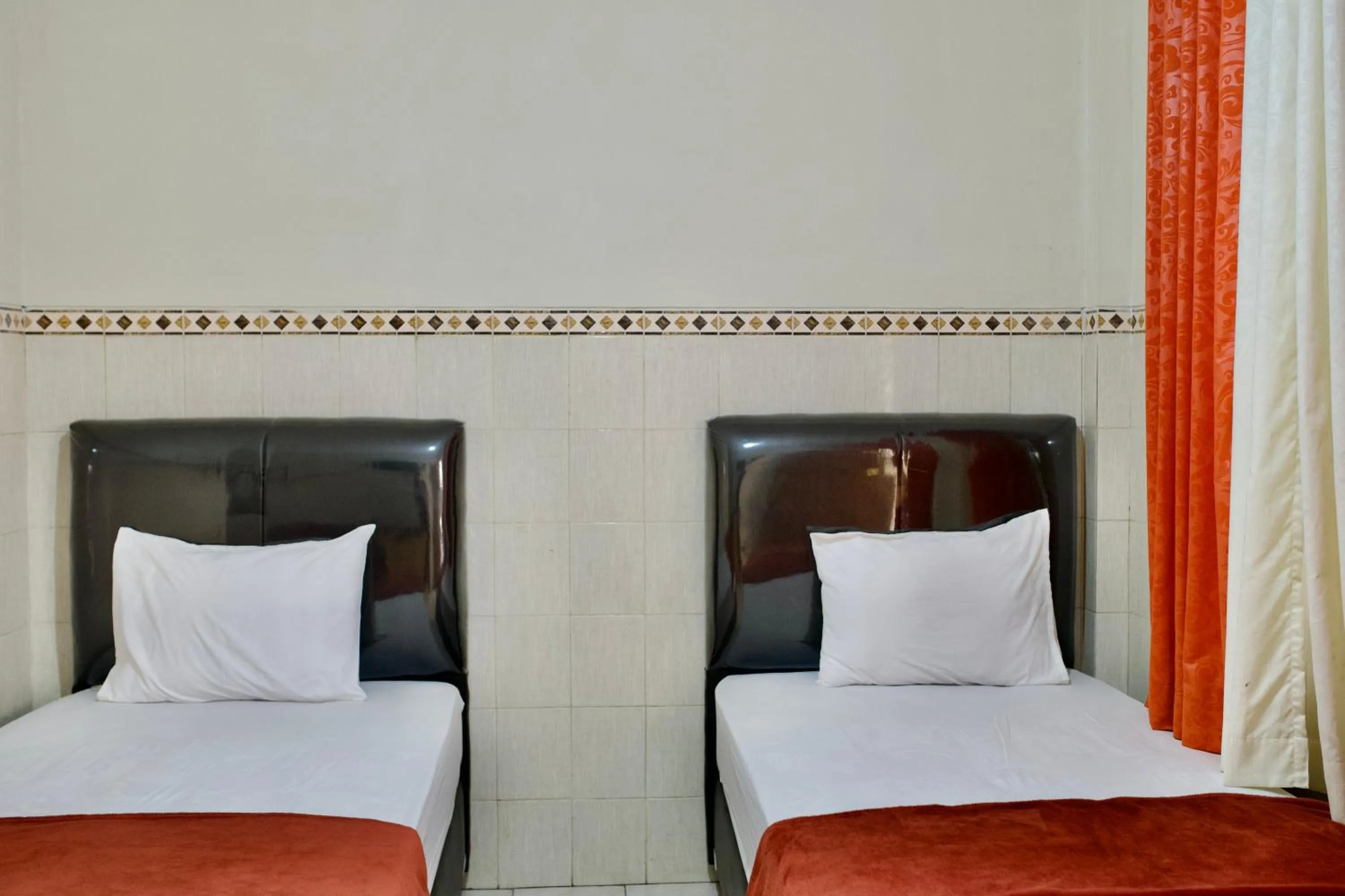 Bed in Garuda Setia Hotel