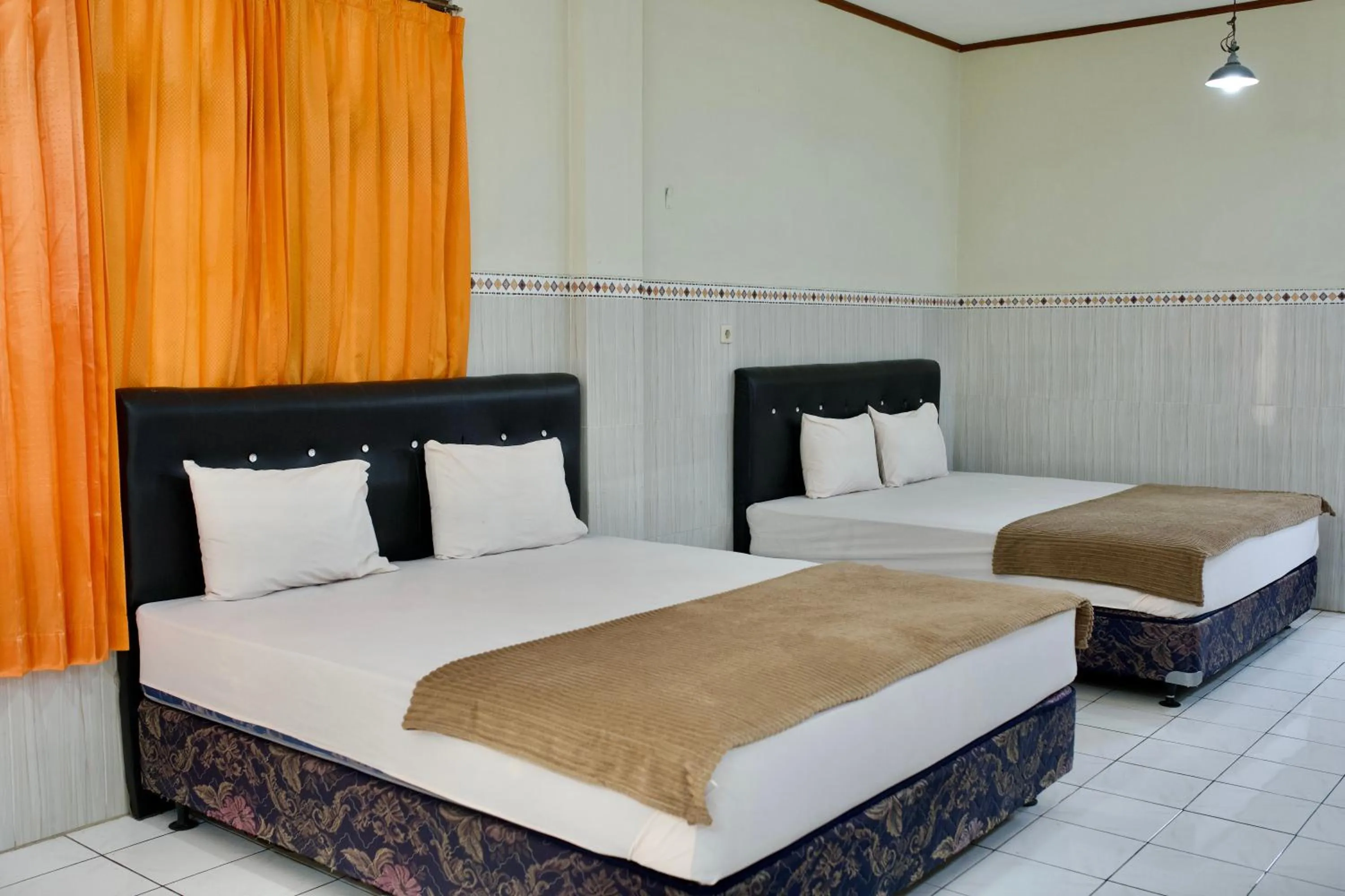 Bed in Garuda Setia Hotel