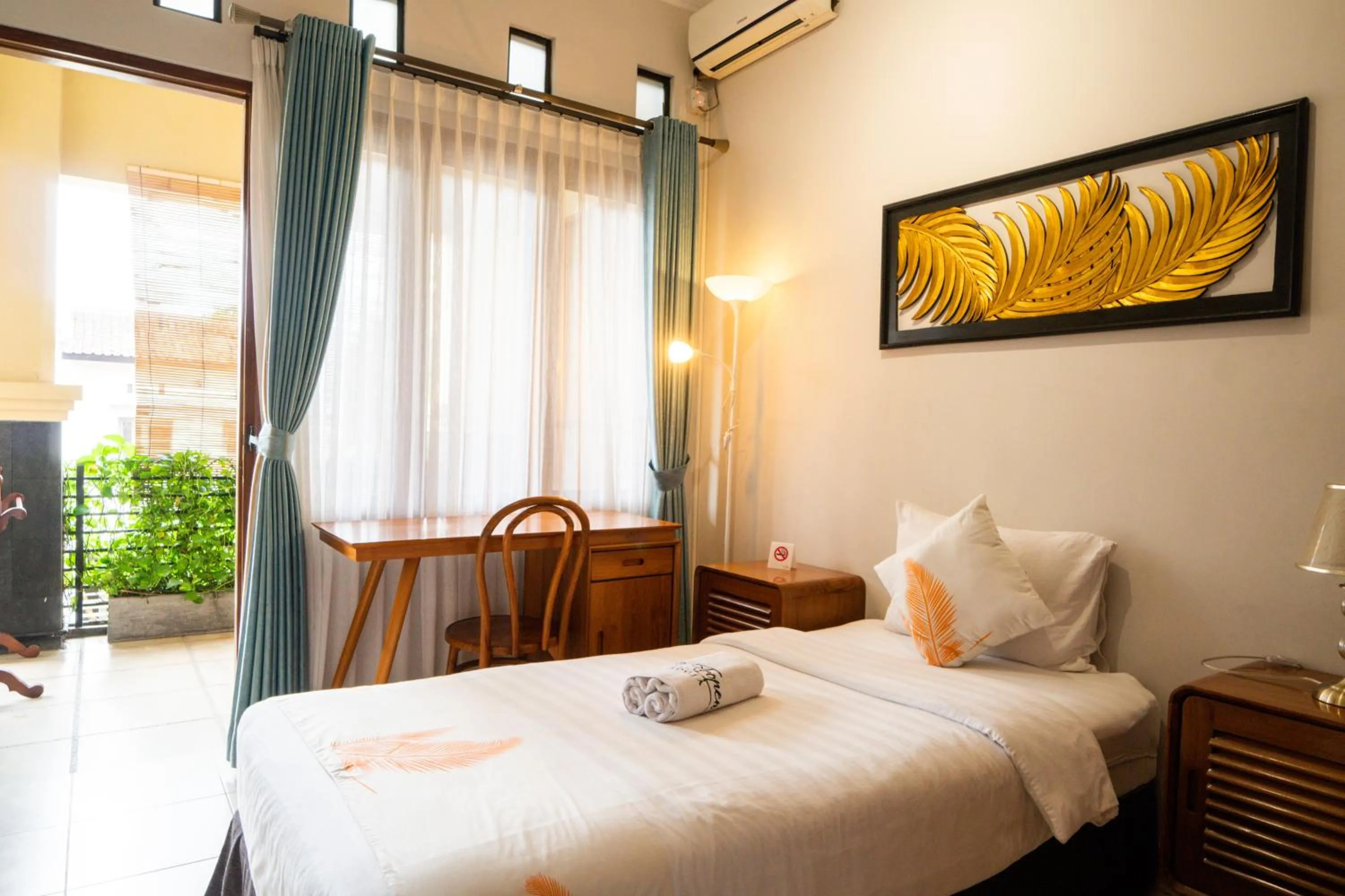 Bed in De Tropen Jogja Villa